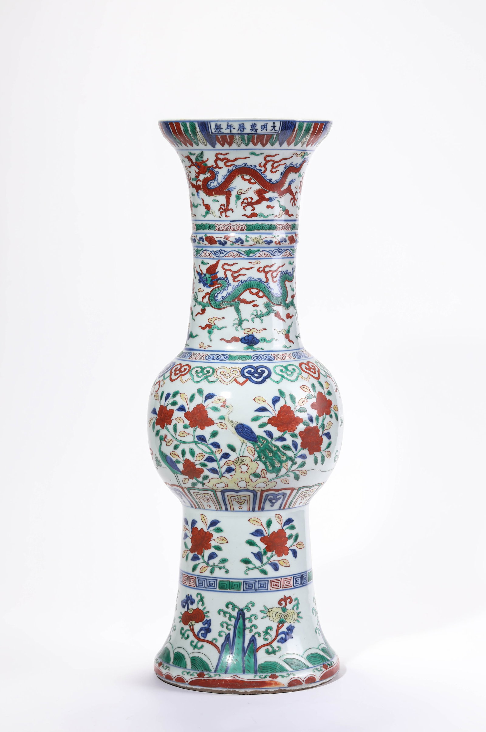 A Wucai 'Dragon Chasing a Pearl, Flowers, Birds and Waves' Gu Beaker: A Wucai 'Dragon Chasing a Pearl, Flowers, Birds and Waves' Gu Beaker (20 x 57.2cm)