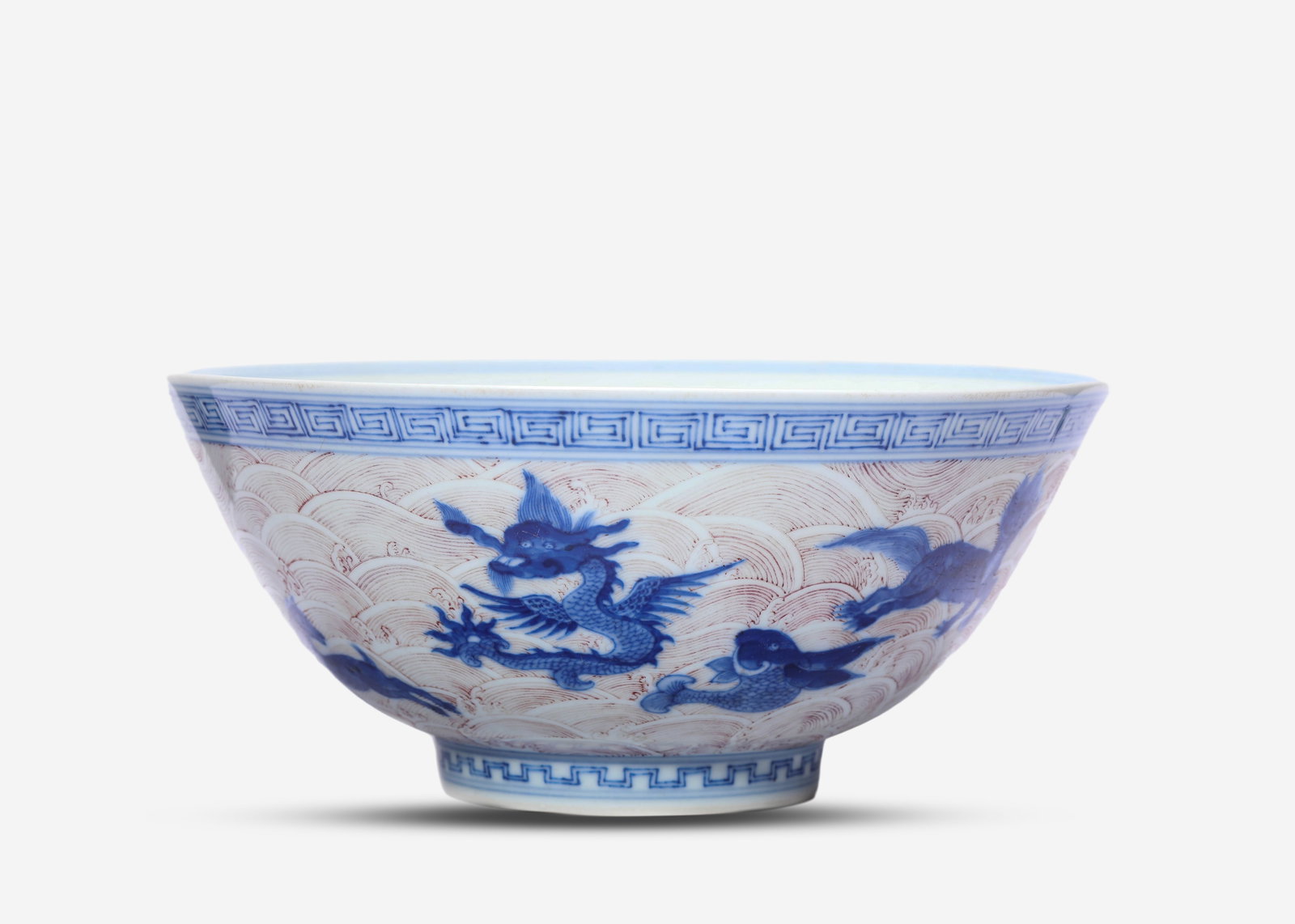 A Blue and White and Underglaze-Red 'Auspicious Beast Amidst Waves' Bowl: A Blue and White and Underglaze-Red 'Auspicious Beast Amidst Waves' Bowl (21.3 x 9.5cm)