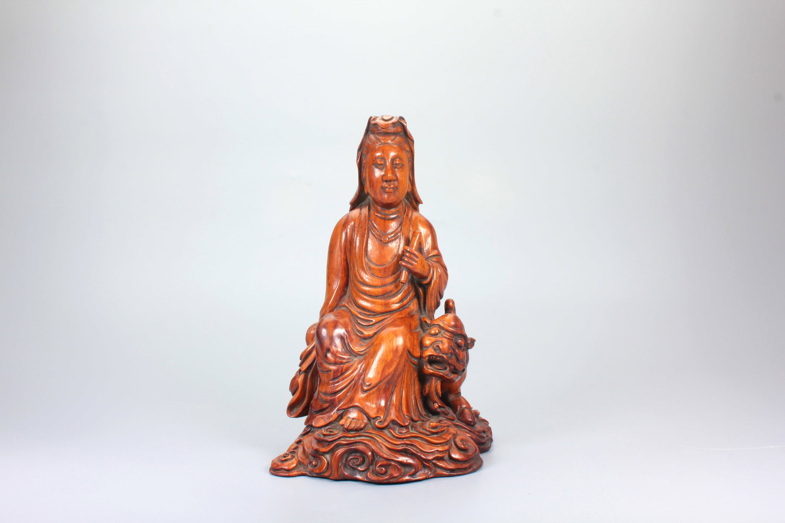 A HUANGHUALI FIGURE OF MANJUSRI BODHISATTVA: A HUANGHUALI FIGURE OF MANJUSRI BODHISATTVA H:17.5CM,L:12.5CM,W:10.5CM