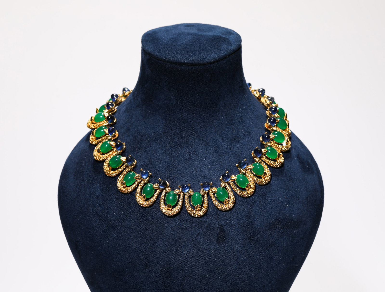 A GILT-BRONZE AND GEM-SET NECKLACE: A GILT-BRONZE AND GEM-SET NECKLACE Description: Dimensions: Weight: 108 g. Length: 19 cm. All measurements are approximate.