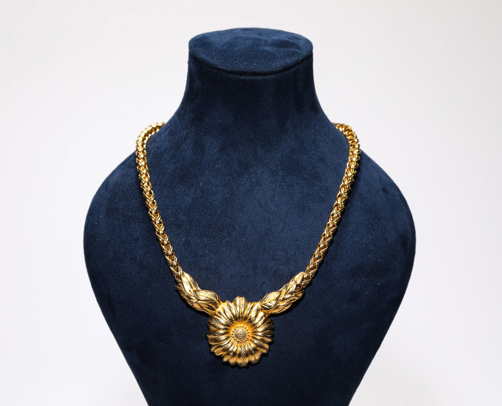 A GILT-BRONZE ‘FLOWER-FORM’ NECKLACE: A GILT-BRONZE ‘FLOWER-FORM’ NECKLACE Description: Dimensions: Weight: 70 g. Length: 23 cm x Width: 6.8 cm. All measurements are approximate.