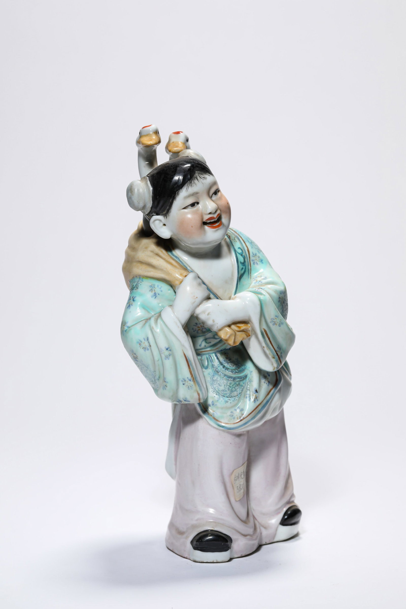 A PORCELAIN FIGURE - 3