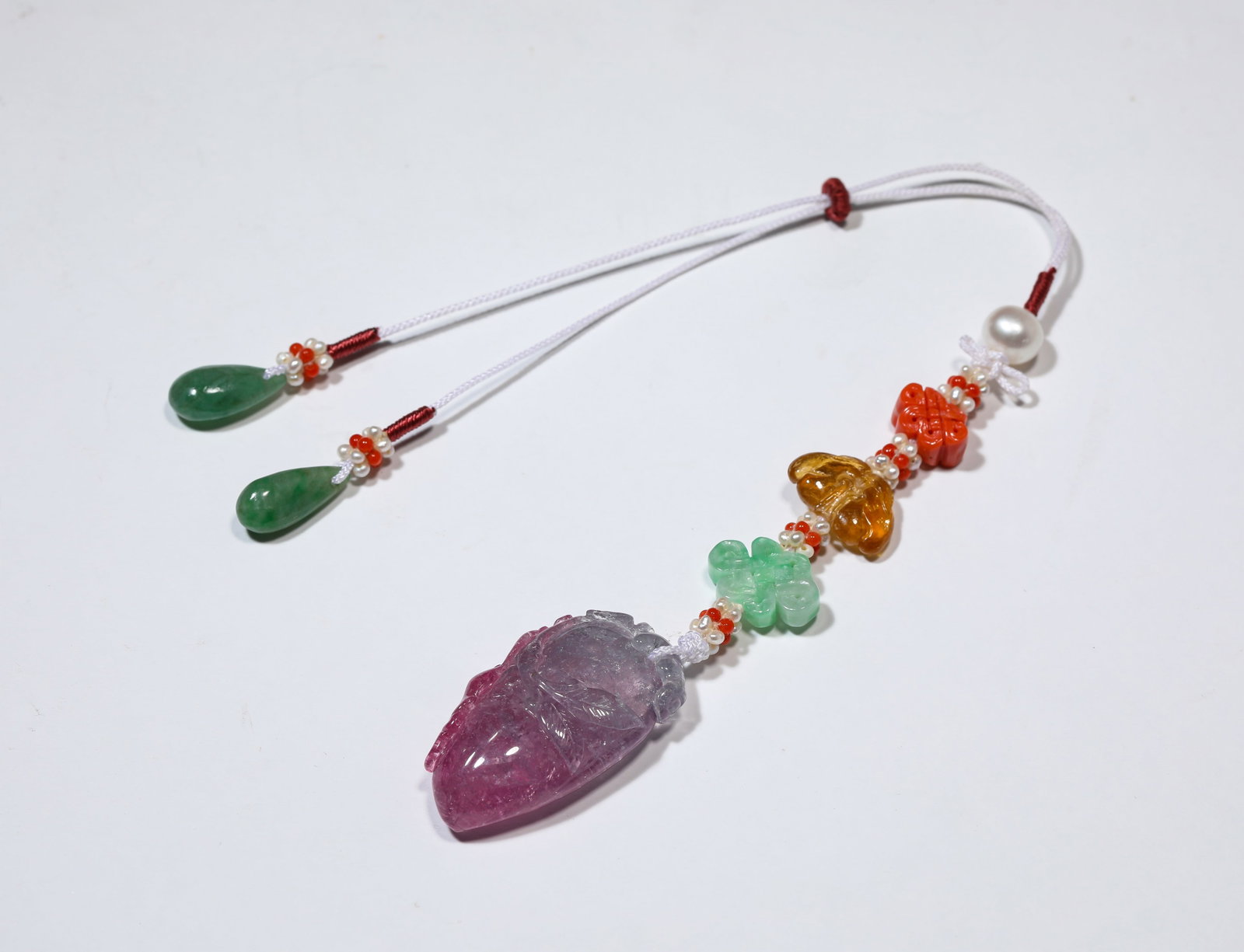 A TOURMALINE PENDANT: A TOURMALINE PENDANT Description: Dimensions: Width: 2 cm x Height: 3.7 cm. All measurements are approximate.