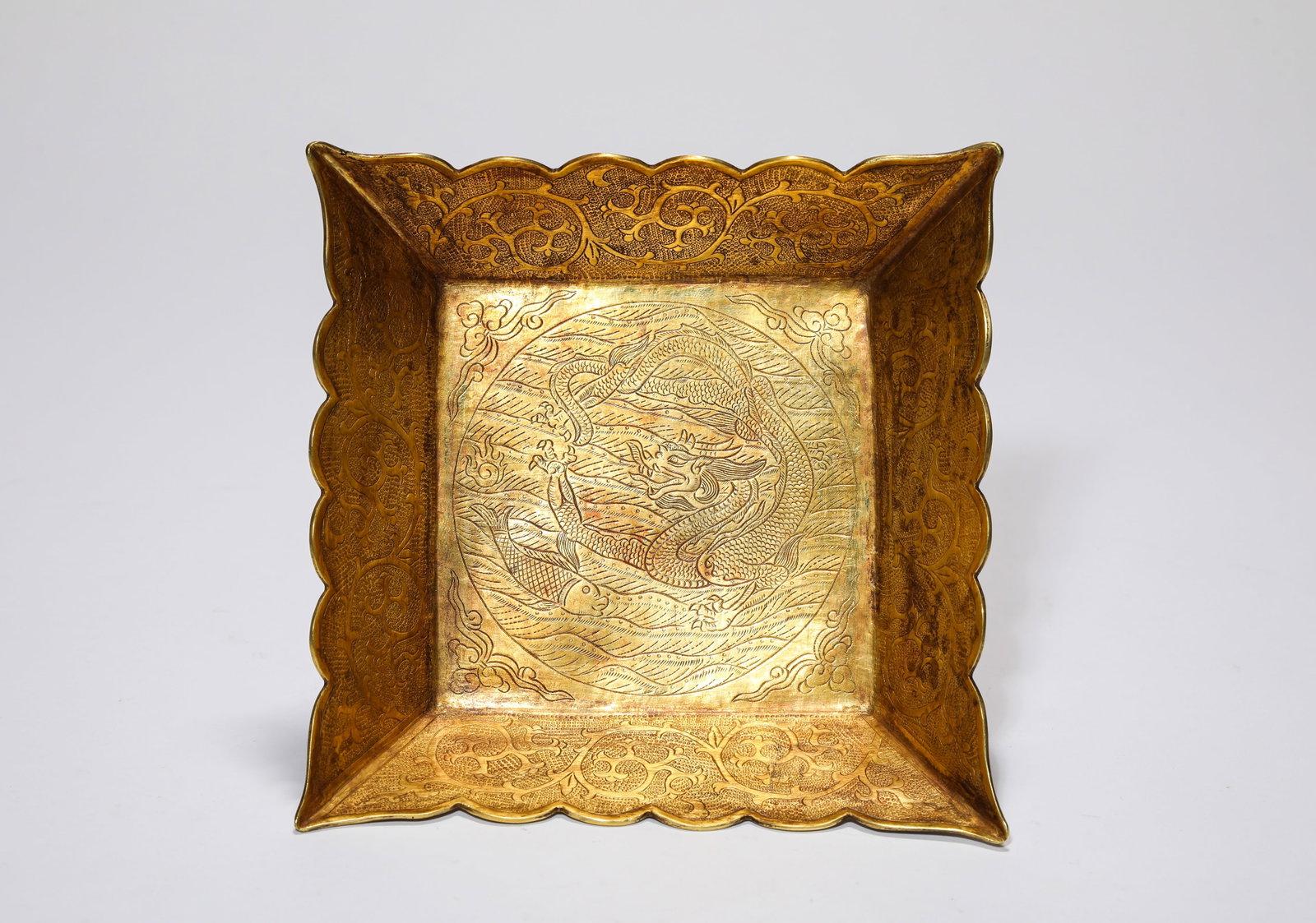 A GOLD ‘DRAGON’ DISH: A GOLD ‘DRAGON’ DISH Description: Dimensions: Weight: 121 g. Width: 14.3 cm x Height: 4 cm. All measurements are approximate.