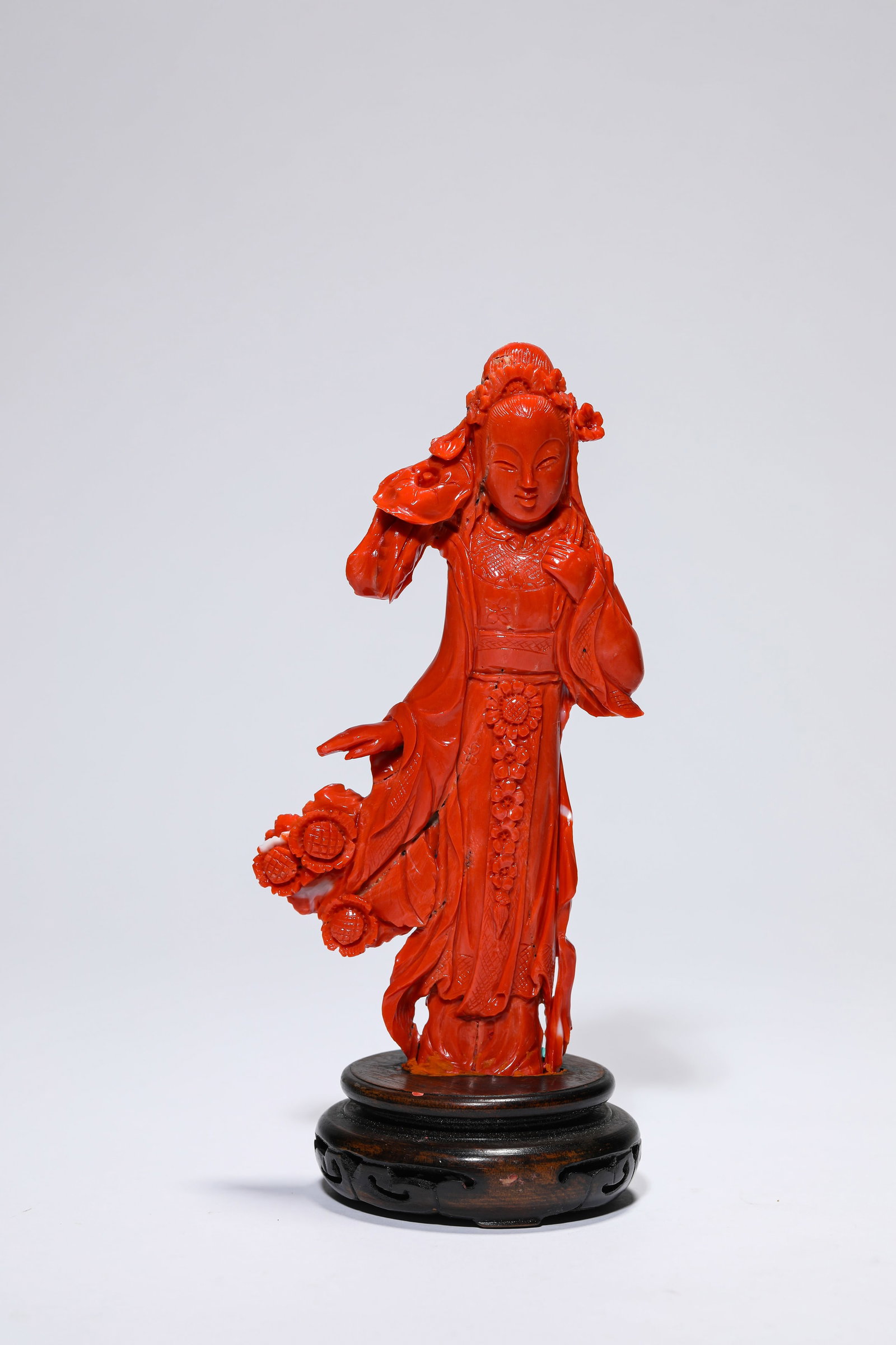 A CORAL ‘LADY’ FIGURE: A CORAL ‘LADY’ FIGURE Description: Dimensions: Length: 7.8 cm x Width: 1.8 cm x Height: 14.5 cm. All measurements are approximate.