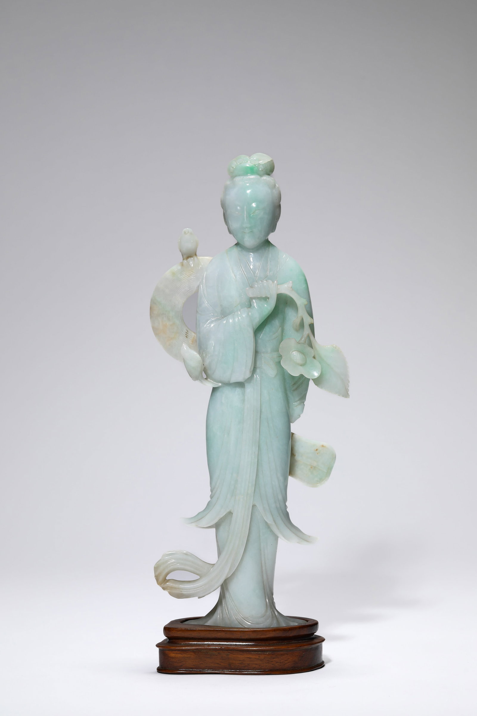 A JADEITE ‘LADY’: A JADEITE ‘LADY’ Description: Dimensions: Length: 11.2 cm x Width: 3.8 cm x Height: 28.2 cm. All measurements are approximate.