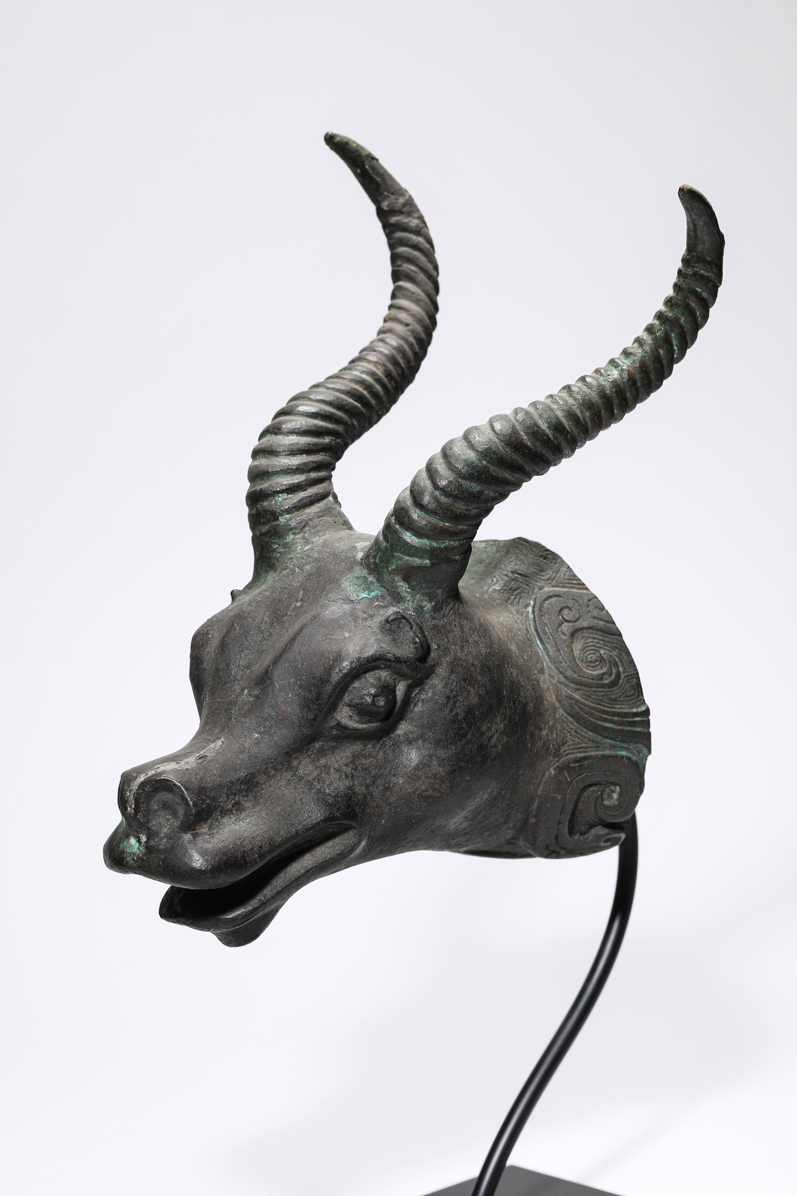 A BRONZE BEAST HEAD - 2