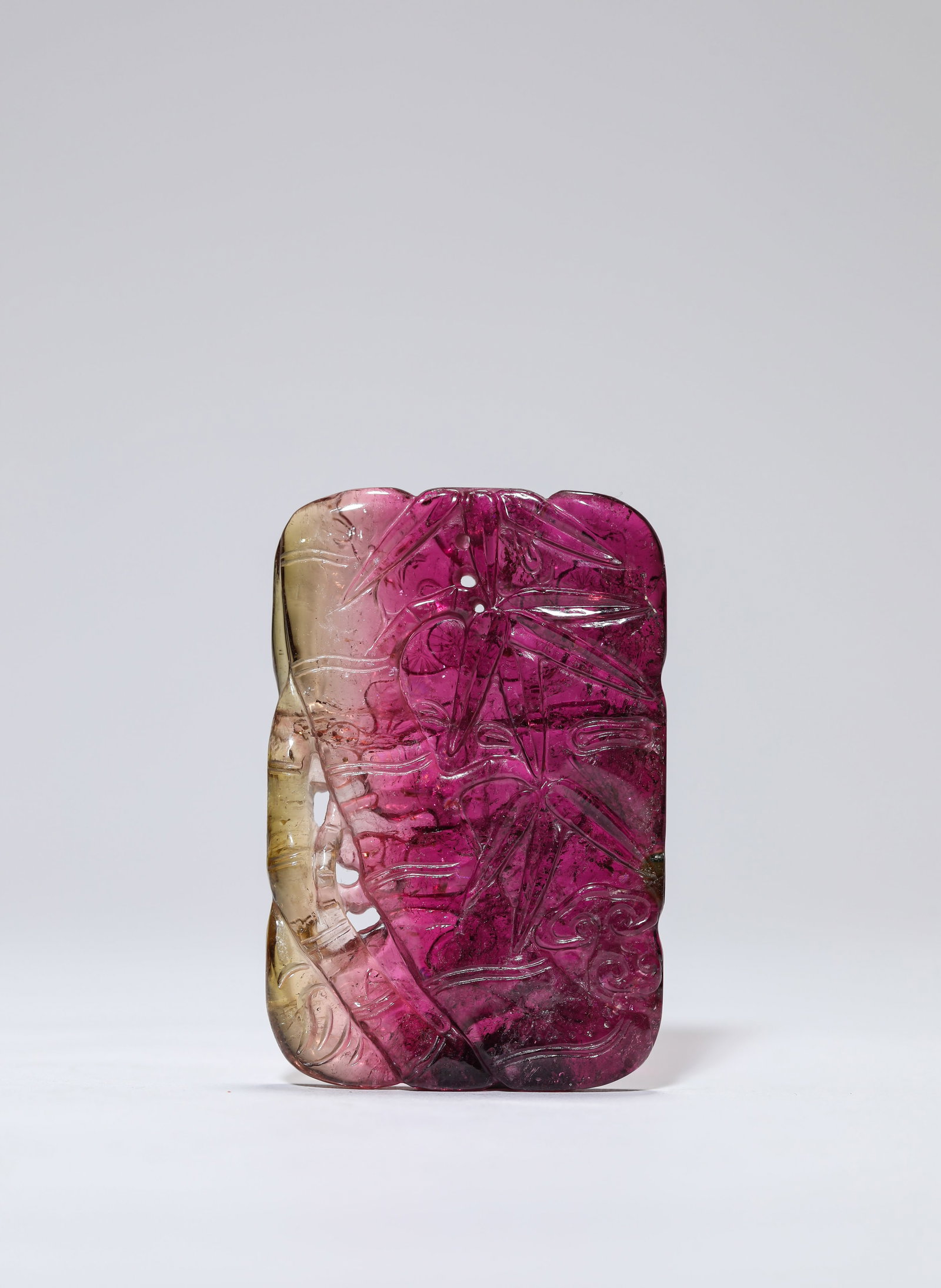 A TOURMALINE ‘PINE, BAMBOO AND PLUM’ PLAQUE: A TOURMALINE ‘PINE, BAMBOO AND PLUM’ PLAQUE Description: Dimensions: Width: 3.9 cm x Height: 5.8 cm. All measurements are approximate.
