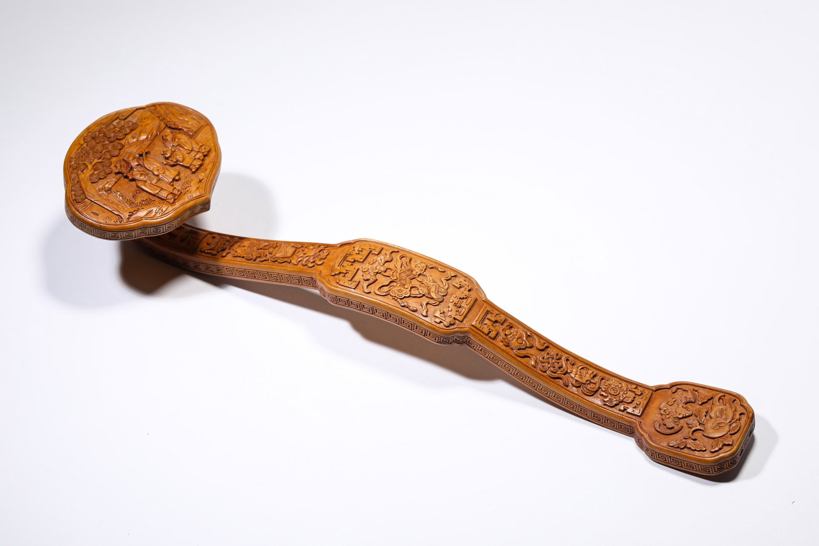 A WOOD ‘CARVED FIGURAL’ RUYI: A WOOD ‘CARVED FIGURAL’ RUYI Description: Dimensions: Length: 40.5 cm x Width: 10.5 cm x Height: 7 cm. All measurements are approximate.