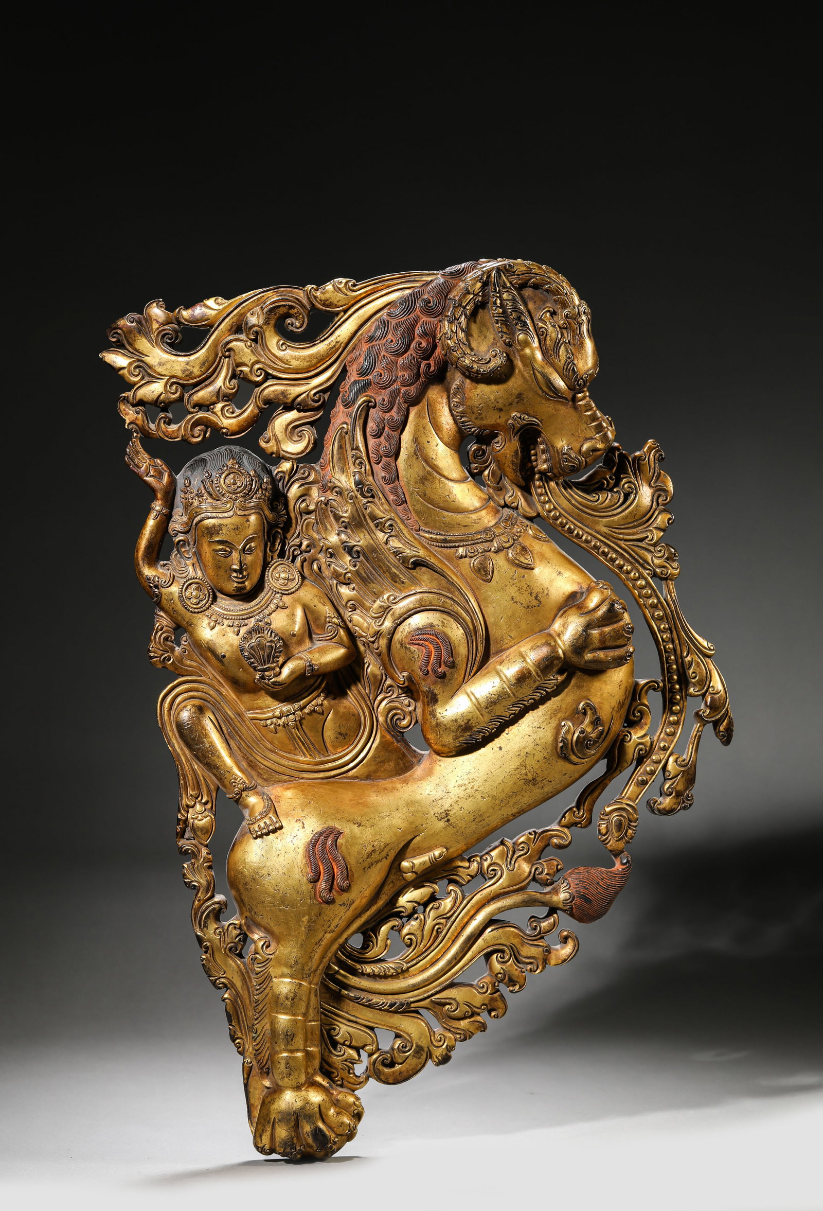 A TIBETAN DENSATIL-STYLE MYTHICAL BEAST: A TIBETAN DENSATIL-STYLE MYTHICAL BEAST Description: Dimensions: Weight: 6650 g. Width: 29 cm x Height: 42.5 cm. All measurements are approximate.