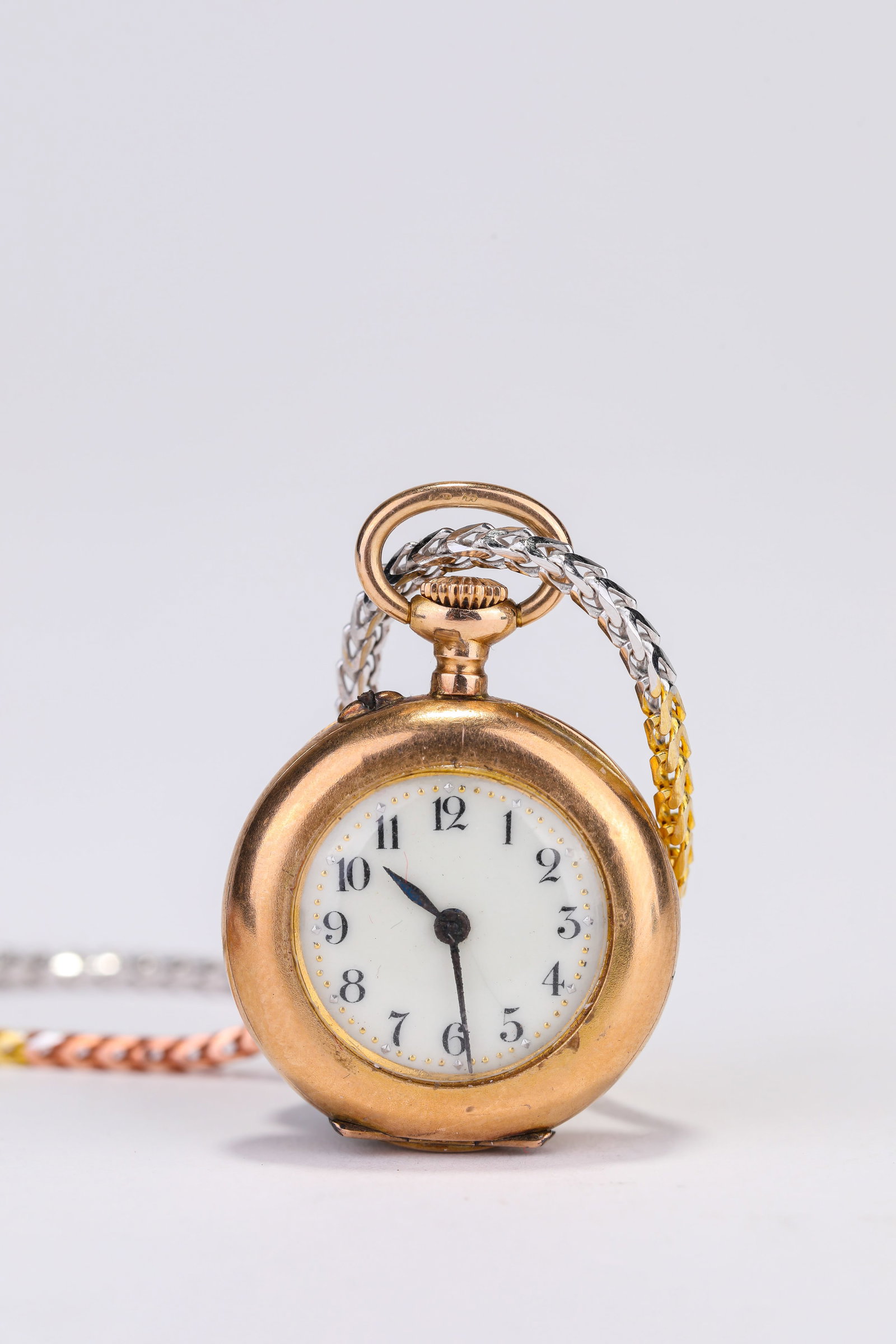 A JAEGER-LECOULTRE 18K GOLD AND PEARL LADIES’ PENDANT WATCH: A JAEGER-LECOULTRE 18K GOLD AND PEARL LADIES’ PENDANT WATCH Description: Dimensions: Weight: 23 g. Width: 29 mm. All measurements are approximate.
