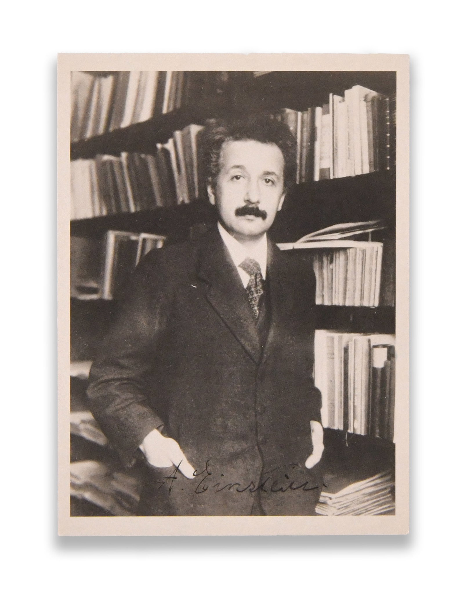 ALBERT EINSTEIN - SIGNED PHOTOGRAPHIC POSTCARD: ALBERT EINSTEIN - SIGNED PHOTOGRAPHIC POSTCARD Provenance and Authenticity: The lot is documented by the complete photographic record supplied for catalogue review, including views of the photographic