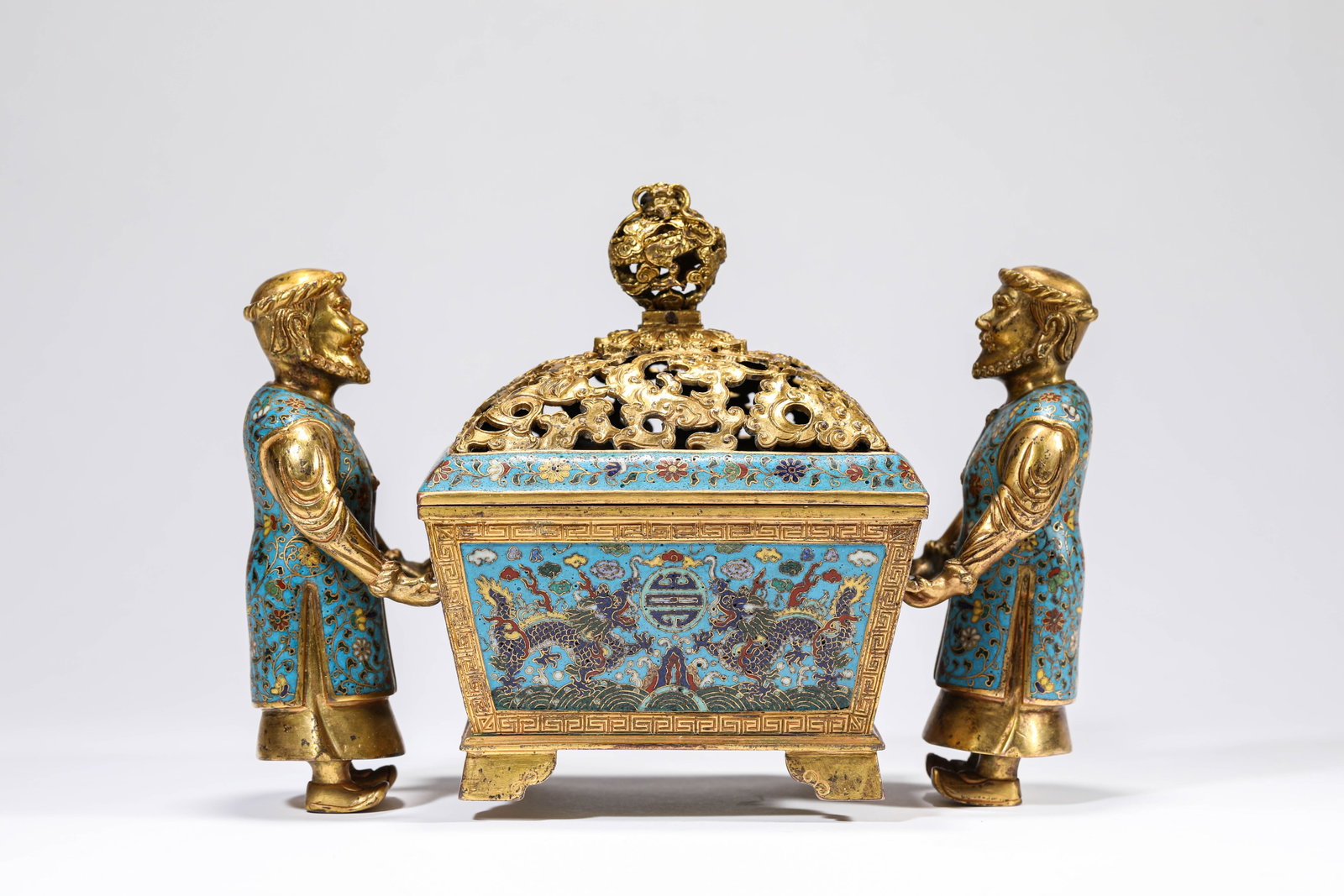 A CLOISONNé ENAMEL ‘FOREIGN FIGURE’ CENSER: A CLOISONNé ENAMEL ‘FOREIGN FIGURE’ CENSER Description: Dimensions: Weight: 2386 g. Length: 22 cm x Width: 10.5 cm x Height: 15.8 cm. All measurements are approximate.