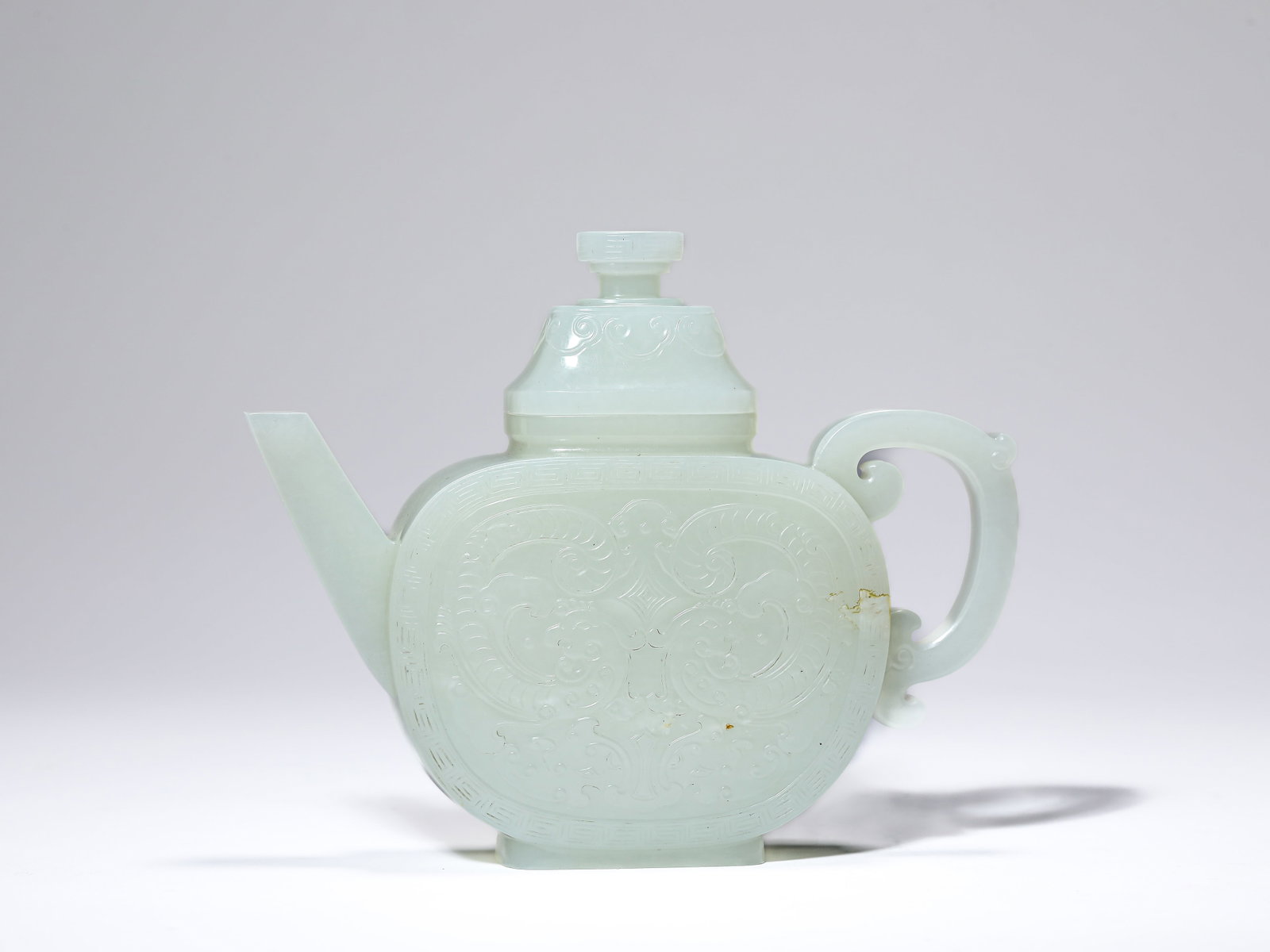 A JADE POT: A JADE POT Description: Dimensions: Length: 15.1 cm x Width: 4.1 cm x Height: 12.2 cm. All measurements are approximate.