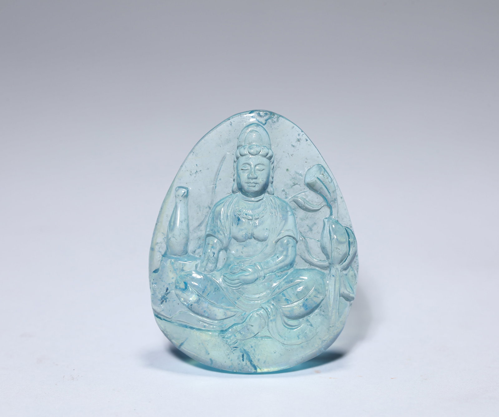 A ROCK CRYSTAL FIGURE OF AVALOKITESHVARA: A ROCK CRYSTAL FIGURE OF AVALOKITESHVARA Description: Dimensions: Length: 4.1 cm x Width: 1.3 cm x Height: 5 cm. All measurements are approximate.