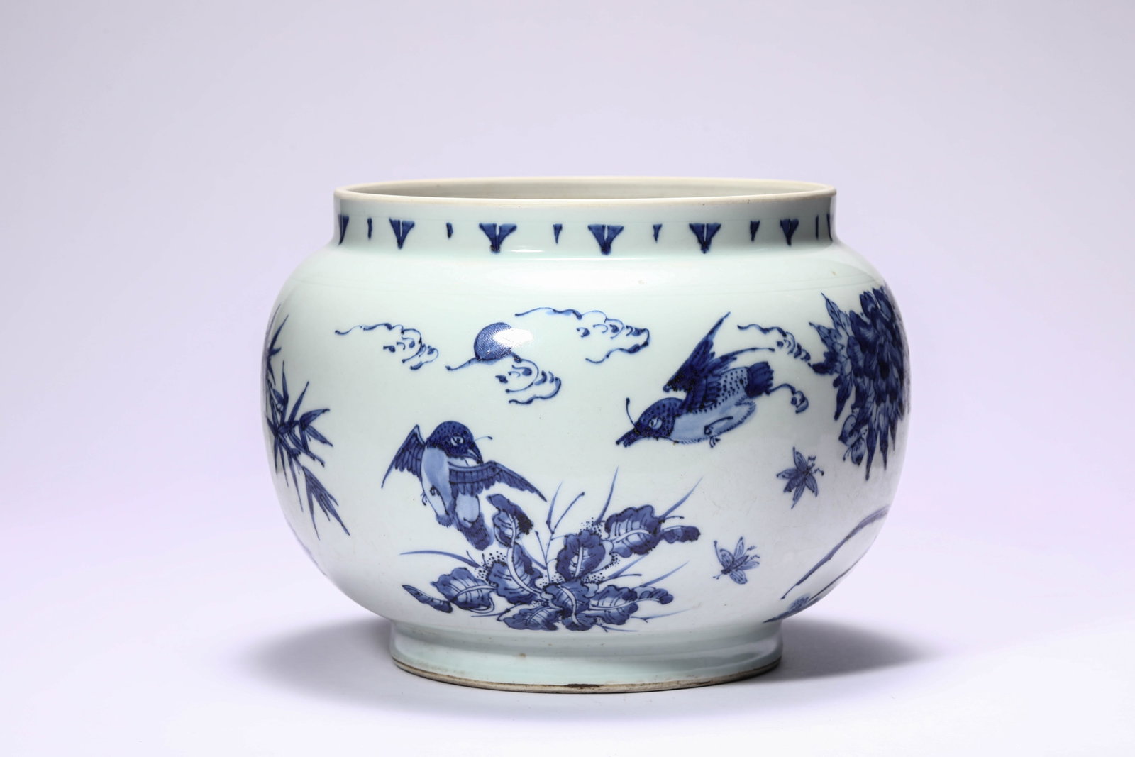 A BLUE AND WHITE 'FLOWERS, BIRDS AND ROCK' JAR: A BLUE AND WHITE 'FLOWERS, BIRDS AND ROCK' JAR Description: Dimensions: Width: 21.9 cm x Height: 16.4 cm. All measurements are approximate.
