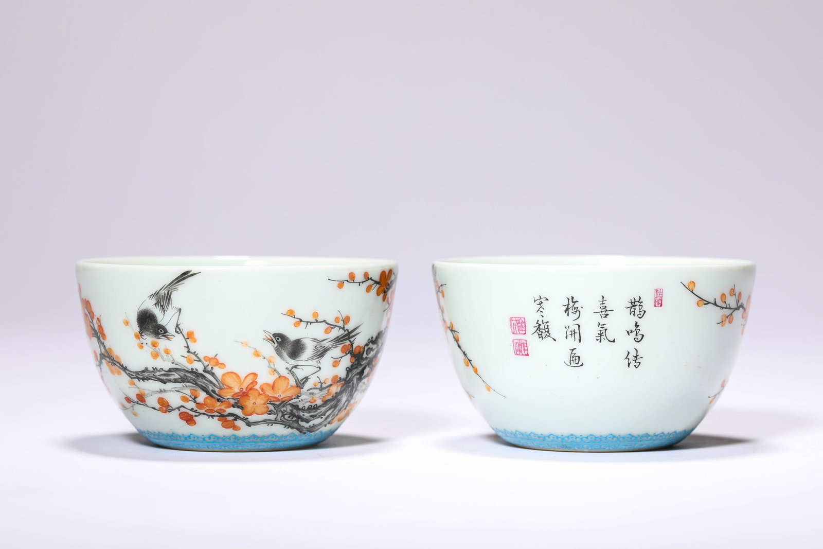 A PAIR OF IRON-RED AND BLACK-DECORATED 'MAGPIES ON A PLUM BRANCH AND POEM' CUPS (1 of 6)