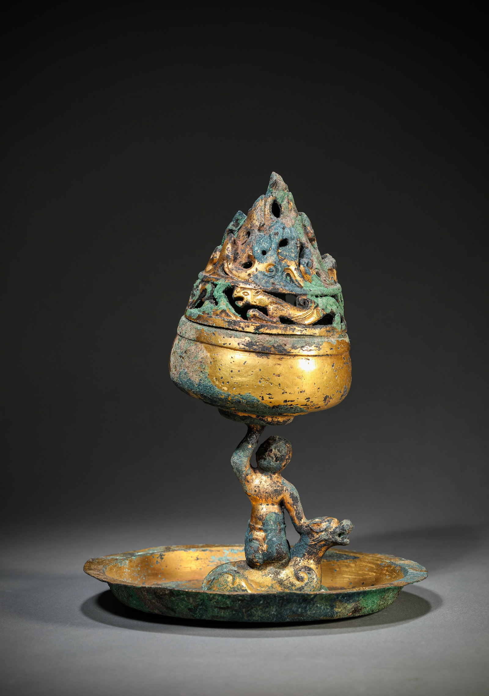 A GILT-BRONZE CENSER: A GILT-BRONZE CENSER Description: Dimensions: Weight: 948 g. Width: 18.4 cm x Height: 23 cm. All measurements are approximate.