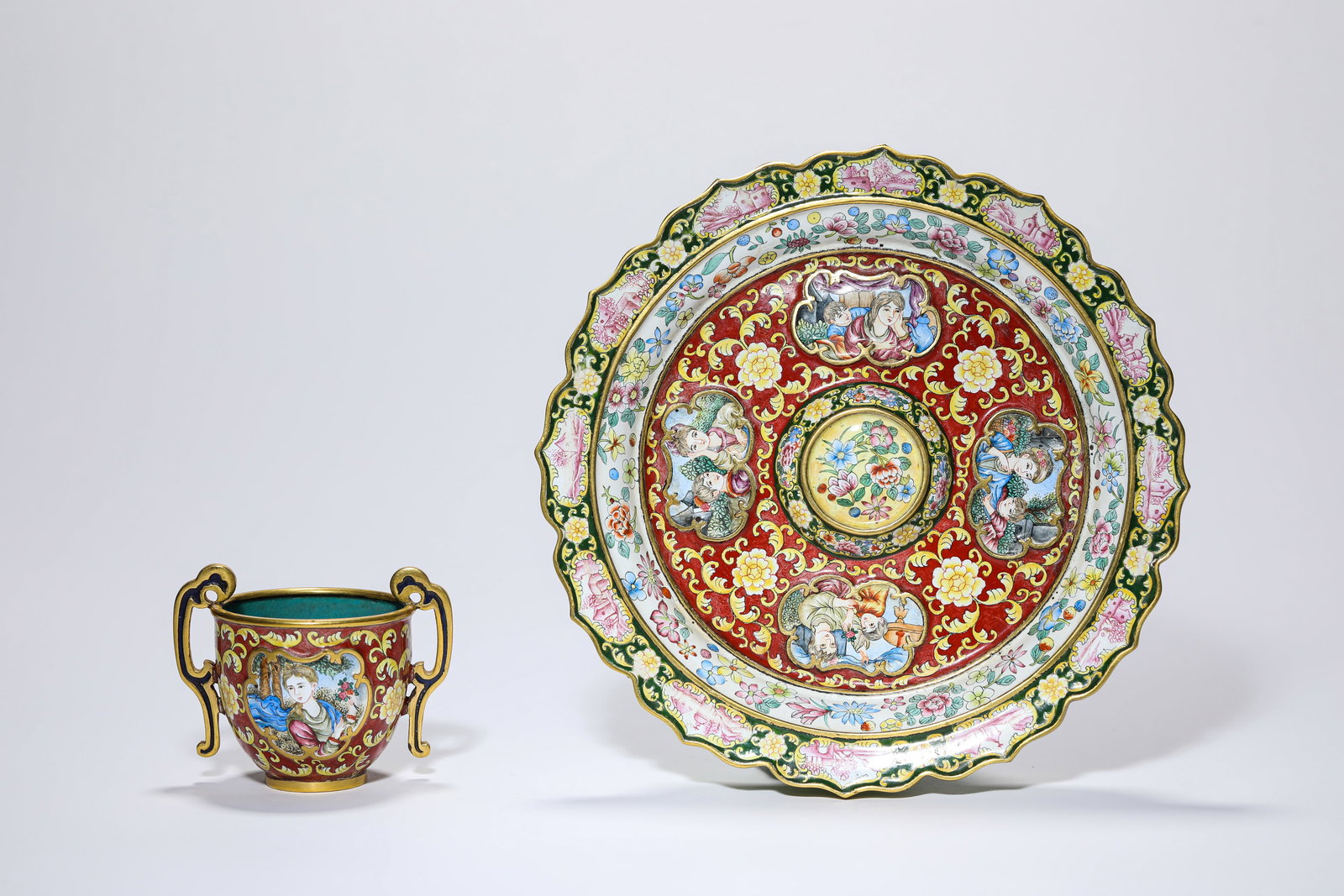 A GROUP OF COPPER PAINTED ENAMEL ‘FLORAL AND FIGURAL’ CUPS AND SAUCERS: A GROUP OF COPPER PAINTED ENAMEL ‘FLORAL AND FIGURAL’ CUPS AND SAUCERS Description: Dimensions: Weight: 429 g. Width: 17.1 cm x Height: 7.5 cm. All measurements are approximate.