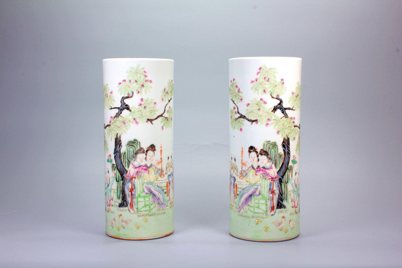 A LINZHI QINGXIANG FAMILLE ROSE FIGURE STORY HAT STAND PAIR (1 of 15)