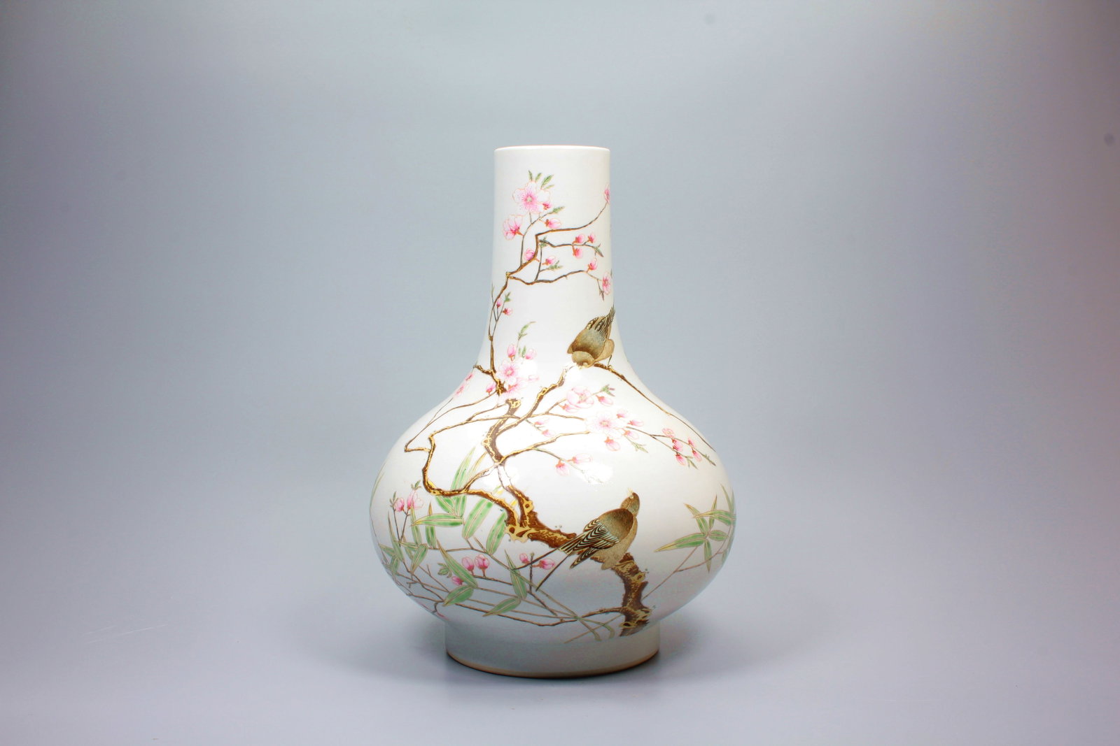 A FAMILLE ROSE MAGPIE ON PRUNUS WATER CHESTNUT VASE: A FAMILLE ROSE MAGPIE ON PRUNUS WATER CHESTNUT VASE H:33.3CM,D:23.5CM
