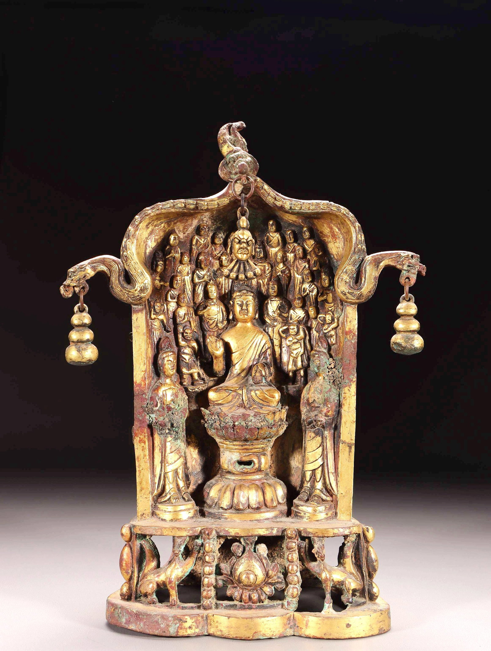 A GILT BRONZE ASSEMBLY OF BUDDHAS SHRINE: A GILT BRONZE ASSEMBLY OF BUDDHAS SHRINE H:25CM,L:17.5CM,W:9.5CM