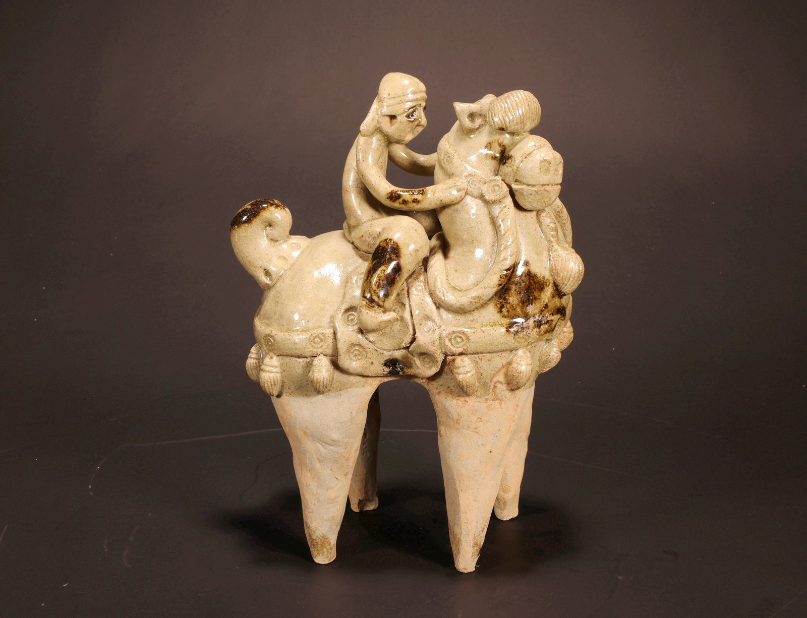 A YUE KILN CELADON FOREIGN HORSEMAN FIGURE (1 of 7)