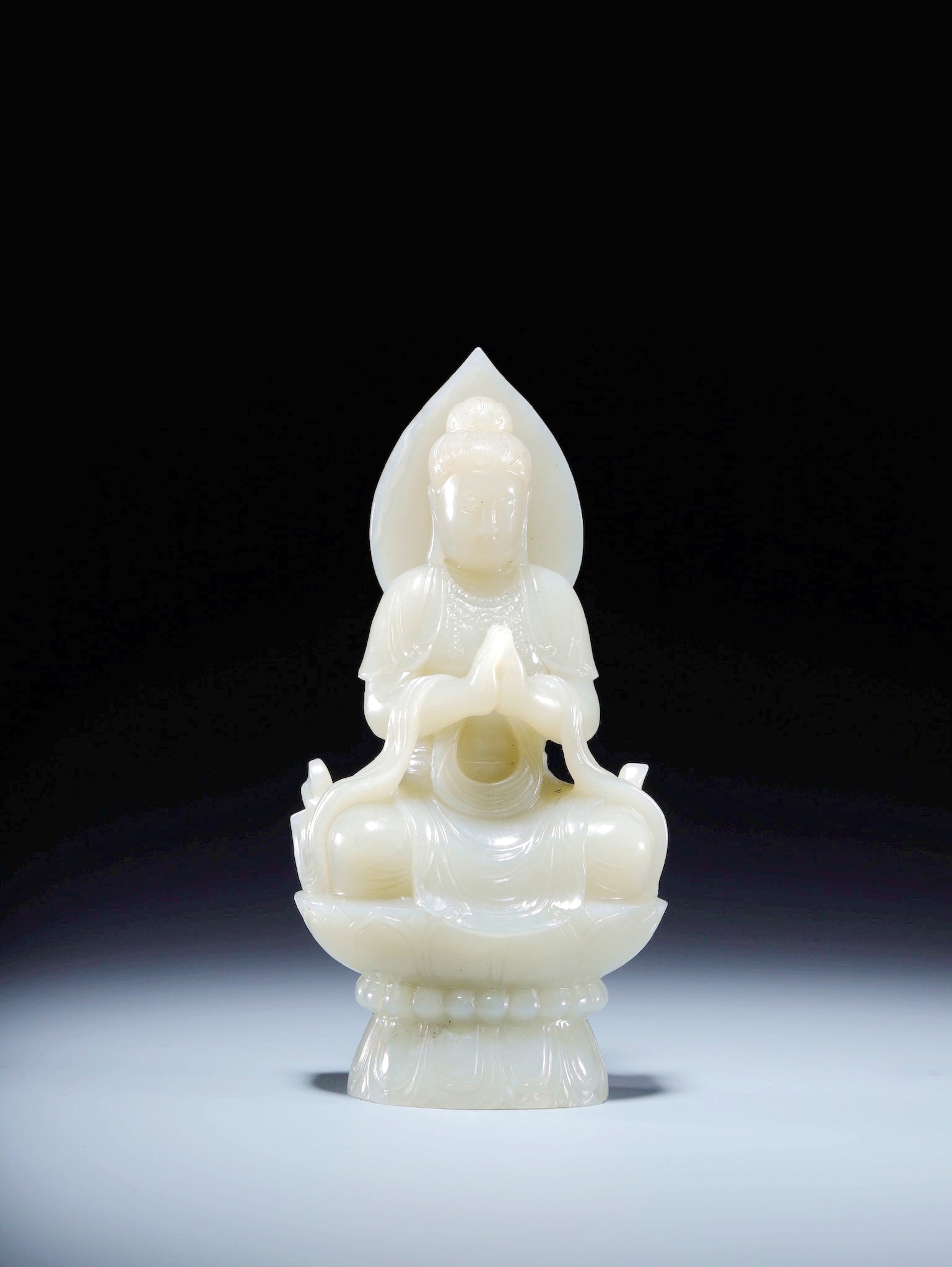 A HETIAN JADE FIGURE OF SEATED GUANYIN (1 of 9)