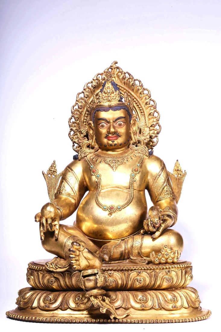 A GILT BRONZE FIGURE OF YELLOW JAMBHALA: A GILT BRONZE FIGURE OF YELLOW JAMBHALA H:33CM,L:25CM,W:19CM,4600G