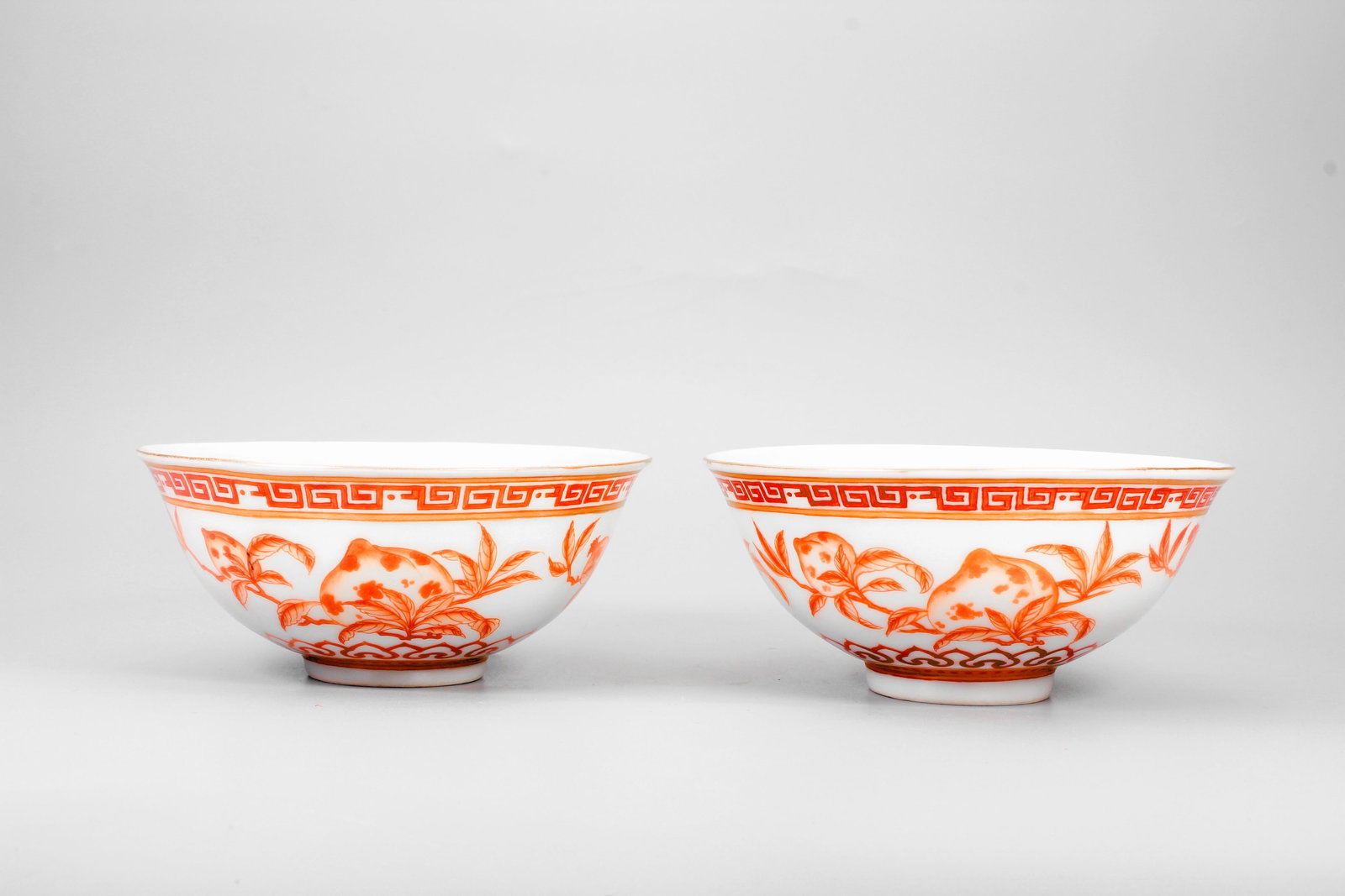 A PAIR OF COPPER RED THREE ABUNDANT FRUITS BOWLS: A PAIR OF COPPER RED THREE ABUNDANT FRUITS BOWLS 1.H:6CM,D:11.5CM;2.H:5.8CM,D:11.4CM