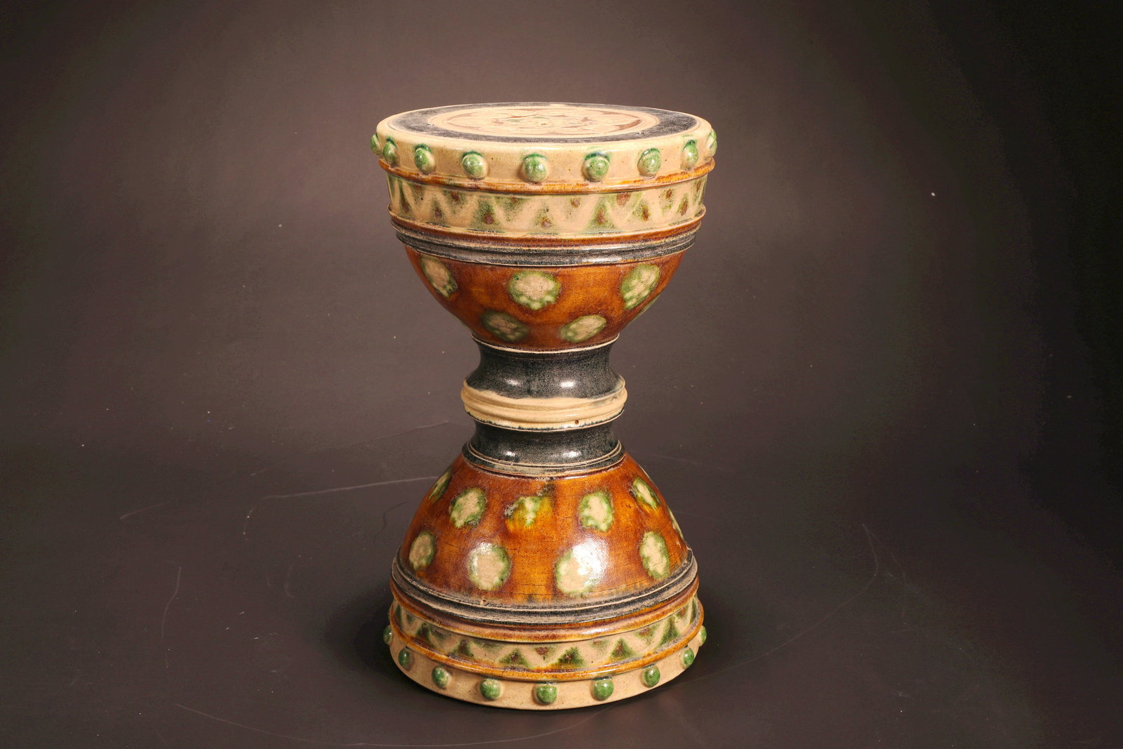 A TANG DYNASTY SANCAI GRAIN PATTERN DRUM (1 of 7)