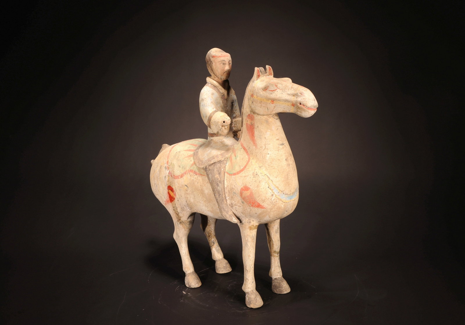 A PAINTED WARRIOR RIDING A HORSE - 2