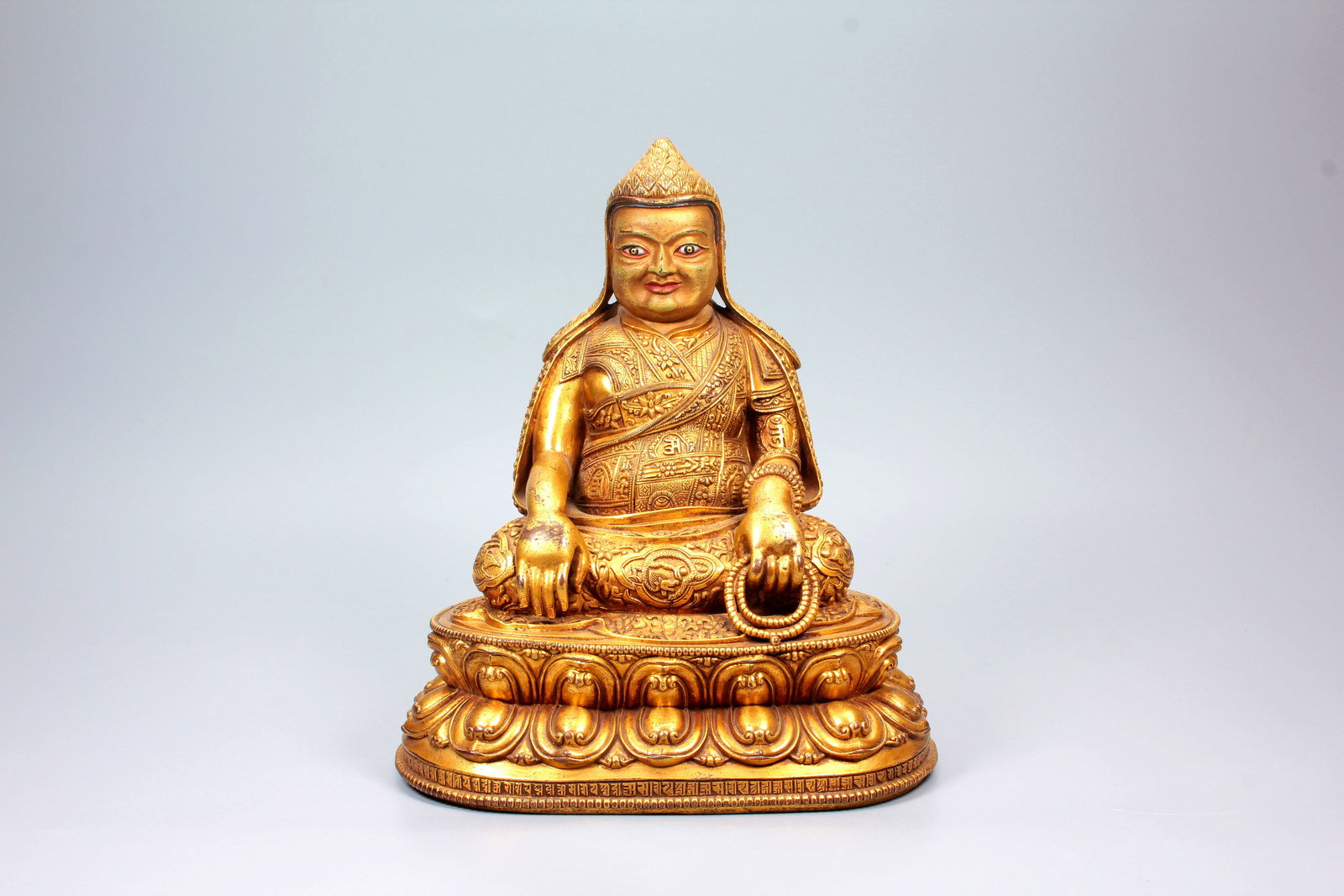 A GILT-BRONZE FIGURE OF DOLBUPA: A GILT-BRONZE FIGURE OF DOLBUPA H:23.2CM,W:20CM
