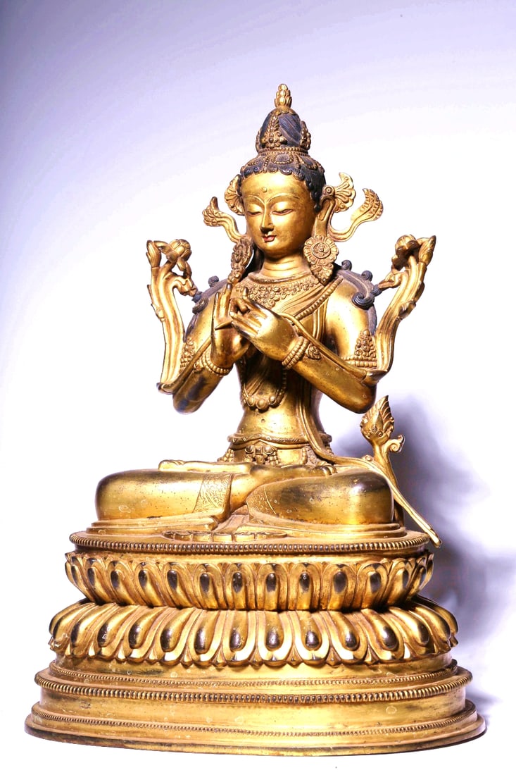 A GILT BRONZE FIGURE OF LOTUS-HOLDING GUANYIN SEATED (1 of 9)
