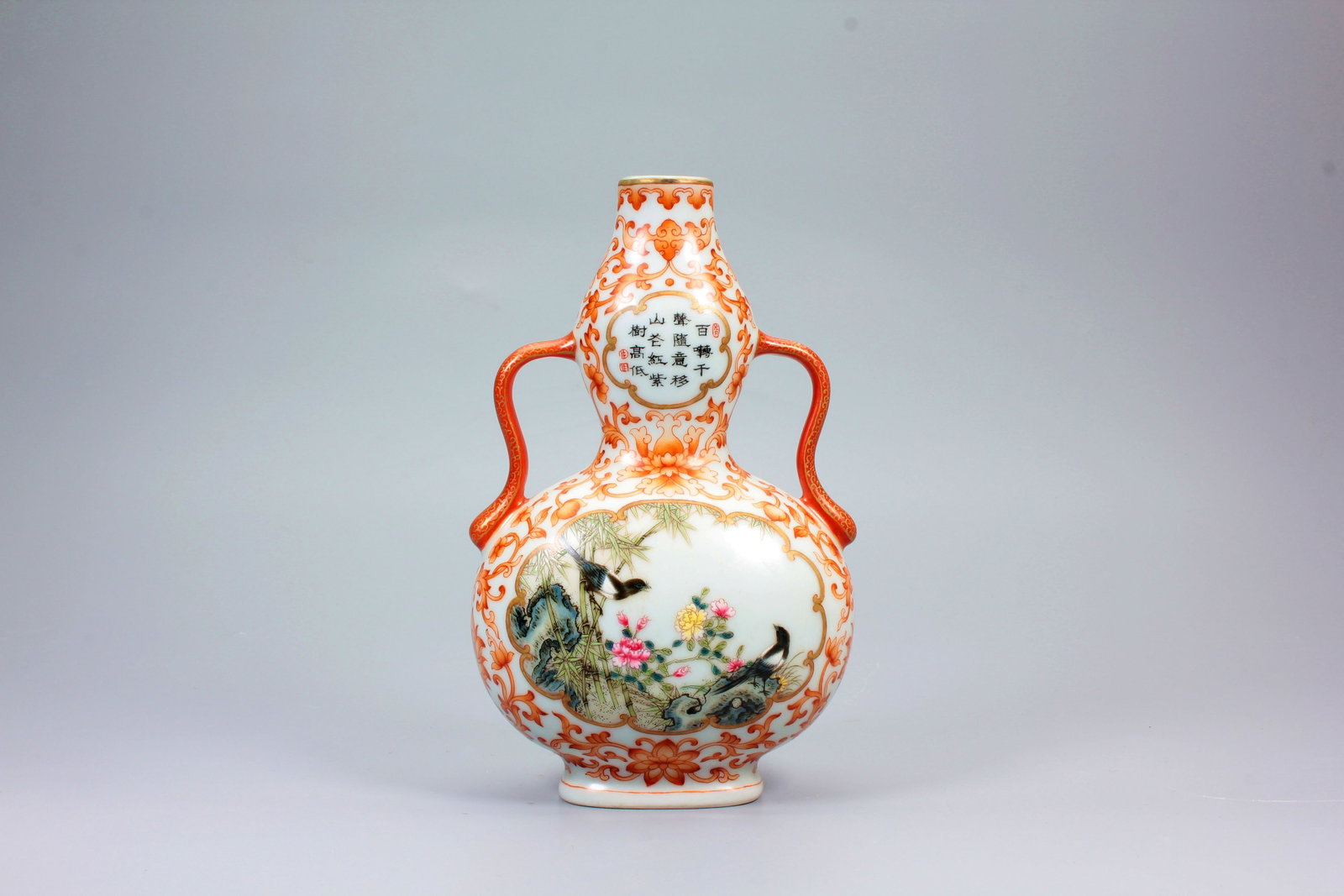 A COPPER RED INTERTWINED LOTUS OPENWORK FAMILLE ROSE BIRD AND FLOWER POEM DOUBLE-GOURD: A COPPER RED INTERTWINED LOTUS OPENWORK FAMILLE ROSE BIRD AND FLOWER POEM DOUBLE-GOURD DOUBLE-HANDLED VASE H:17.8CM,W:10.8CM