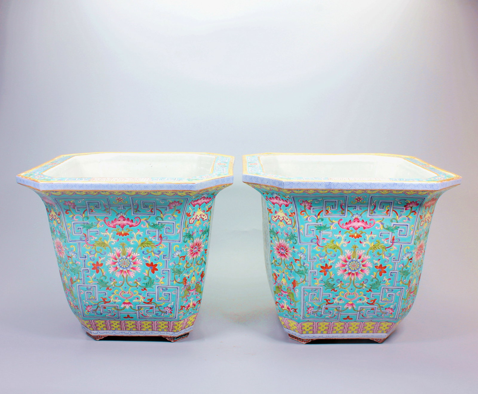 A GREEN GROUND FAMILLE ROSE INTERTWINED LOTUS AUSPICIOUSNESS AND ABUNDANCE FLOWER POT PAIR: A GREEN GROUND FAMILLE ROSE INTERTWINED LOTUS AUSPICIOUSNESS AND ABUNDANCE FLOWER POT PAIR H:28CM,L:33CM,W:33CM
