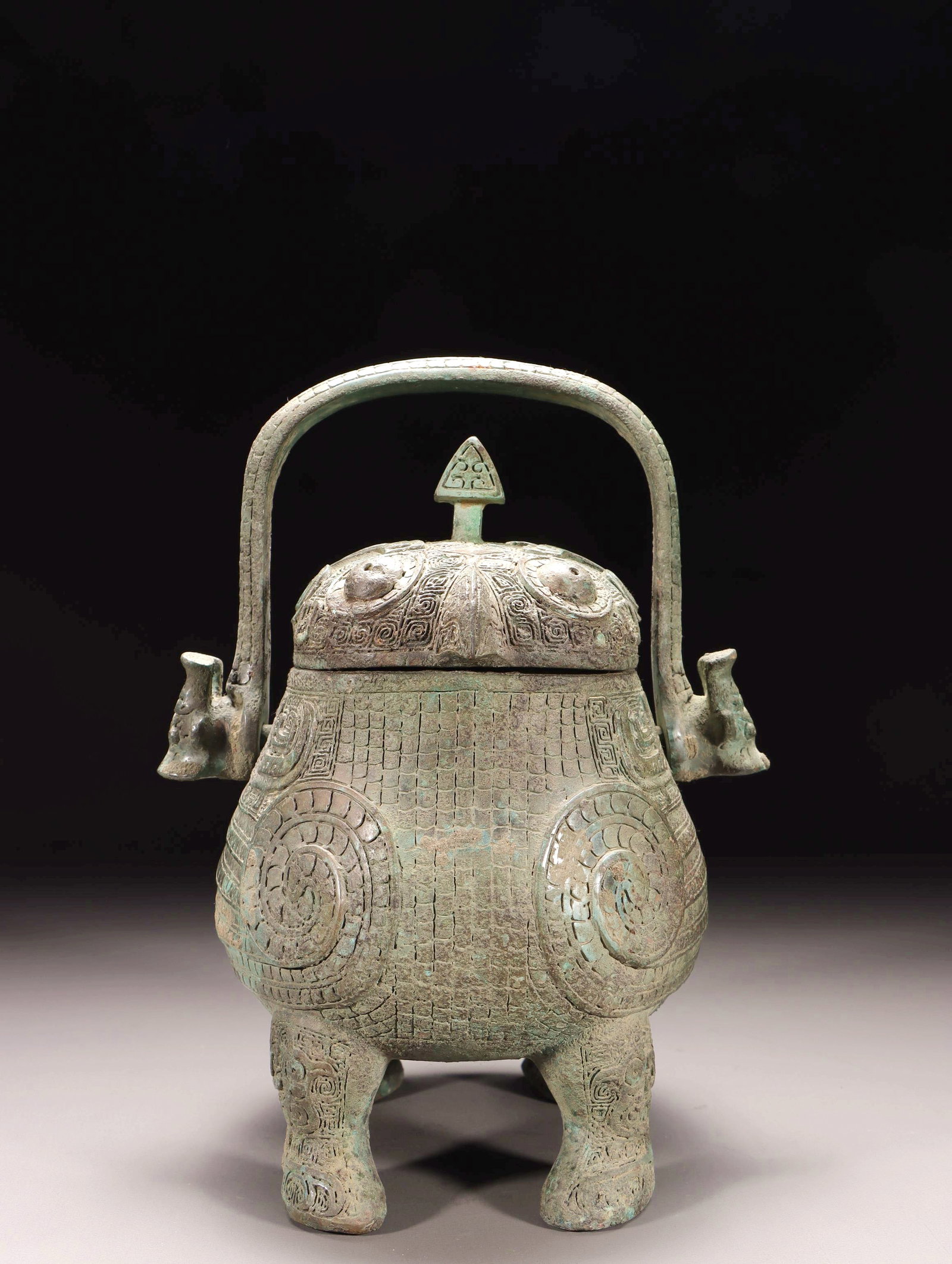 A BRONZE BIRD-SHAPED YOU VESSEL WITH LOOP HANDLE - 10