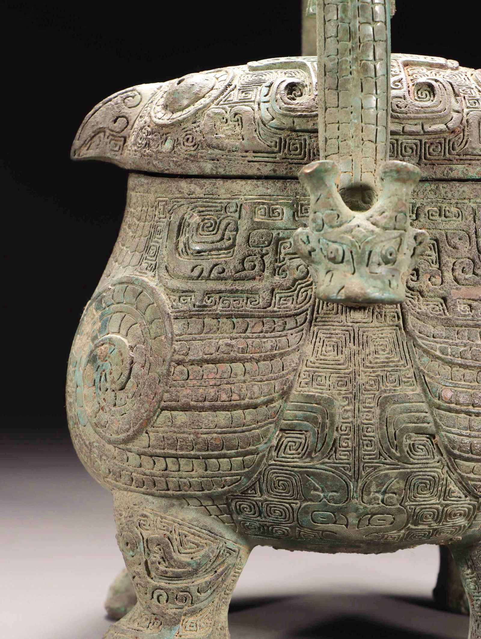 A BRONZE BIRD-SHAPED YOU VESSEL WITH LOOP HANDLE - 6