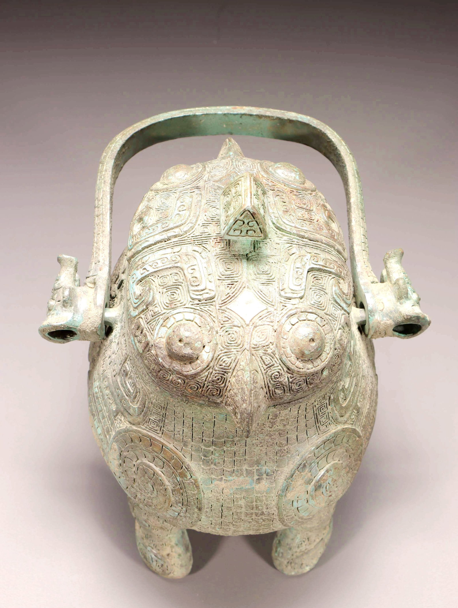 A BRONZE BIRD-SHAPED YOU VESSEL WITH LOOP HANDLE - 7