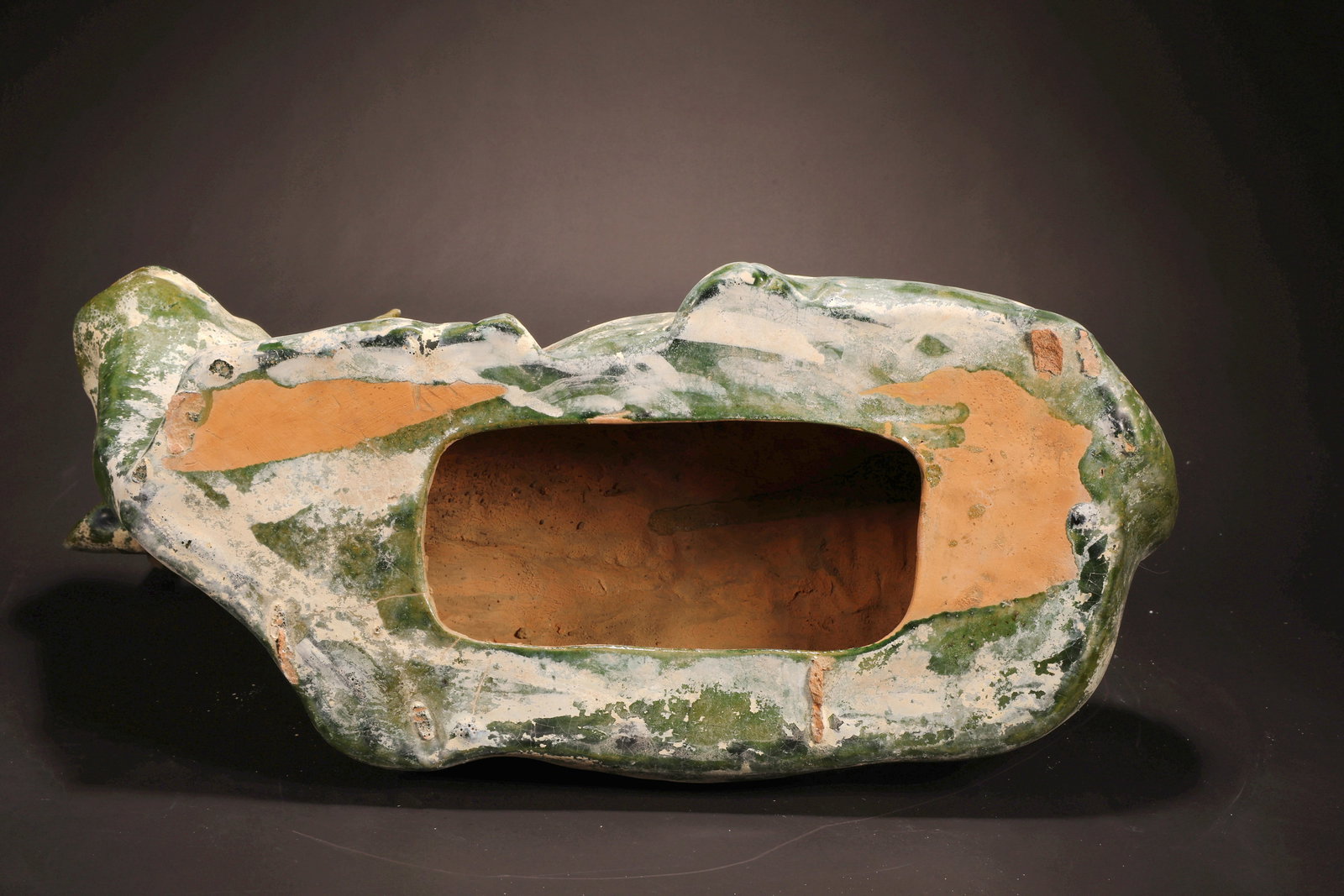 A GREEN GLAZED POTTERY OX - 7