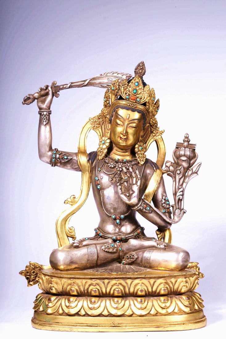 A GILT BRONZE FIGURE OF AND SILVER MANJUSHRI: A GILT BRONZE FIGURE OF AND SILVER MANJUSHRI H:26CM,L:18CM,W:11.5CM,2927G