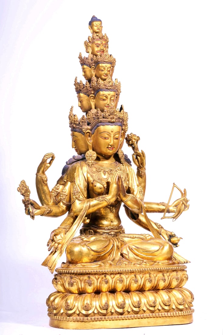 A GILT BRONZE EIGHT-ARM ELEVEN-HEAD FIGURE OF SEATED AVALOKITESHVARA (1 of 14)