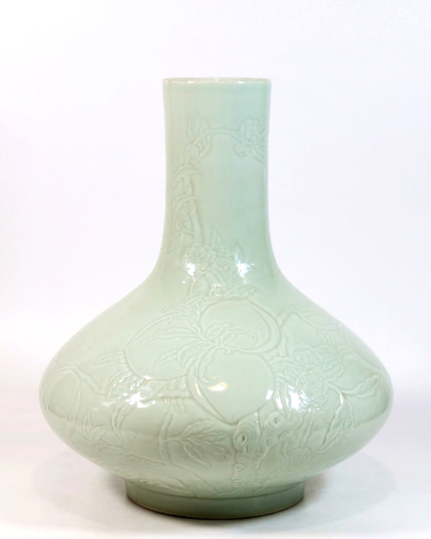 A CELADON GLAZED CARVED PEACH AND BAT WATERCHESTNUT VASE: A CELADON GLAZED CARVED PEACH AND BAT WATERCHESTNUT VASE H:44.2CM,D:32.5CM