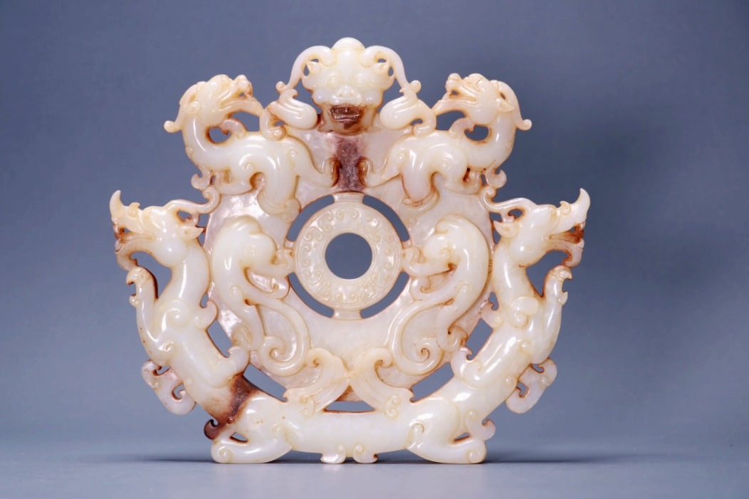 A HETIAN JADE DRAGON PATTERN DISC (1 of 9)