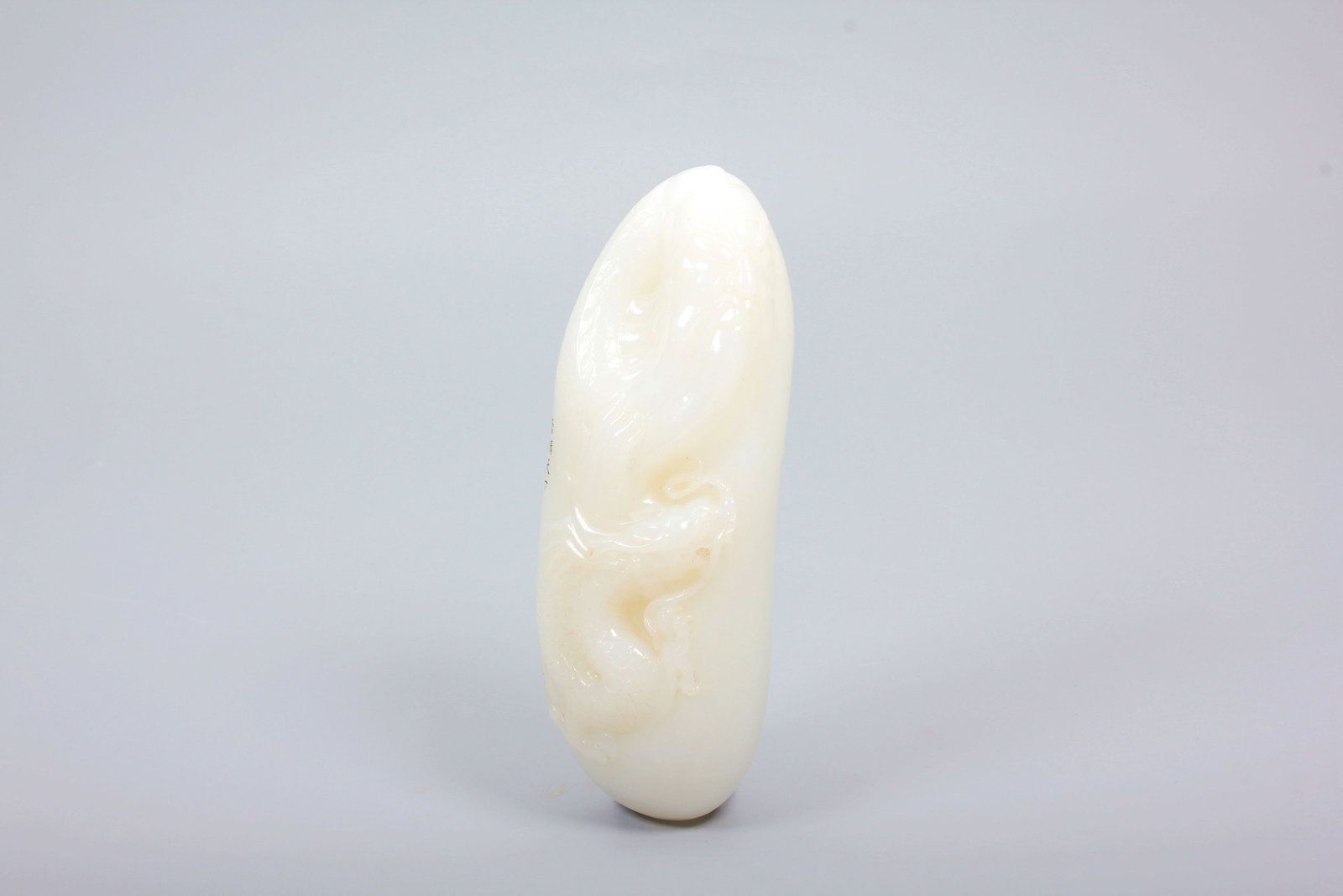 A HETIAN JADE FIGURE OF GUAN GONG: A HETIAN JADE FIGURE OF GUAN GONG H:13.2CM,L:3.8CM,W:4.6CM