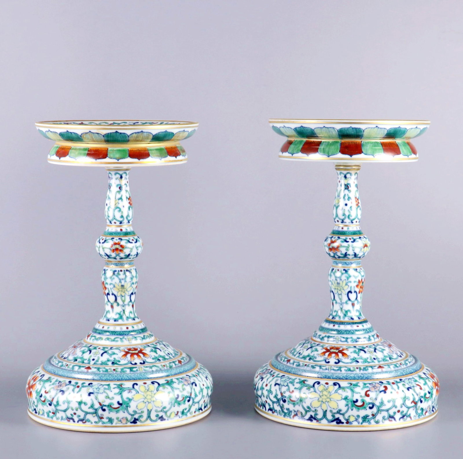 A DOUCAI LOTUS STEM CANDLESTICK WITH TWINING LOTUS: A DOUCAI LOTUS STEM CANDLESTICK WITH TWINING LOTUS H:27.5CM,D:16.5CM