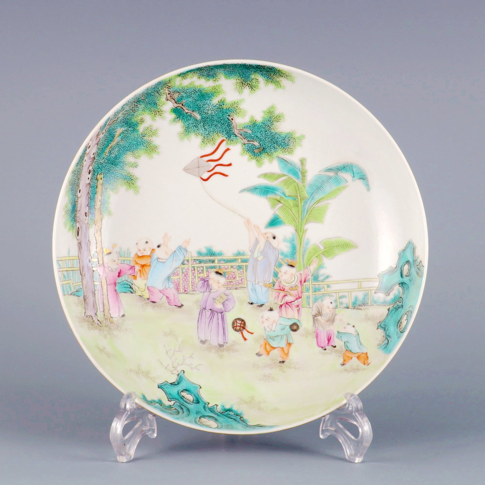 A FAMILLE ROSE BOYS PLAYING OUTER CARMINE RED GROUND ENGRAVED PASSIONFLOWER LARGE DISH (1 of 9)