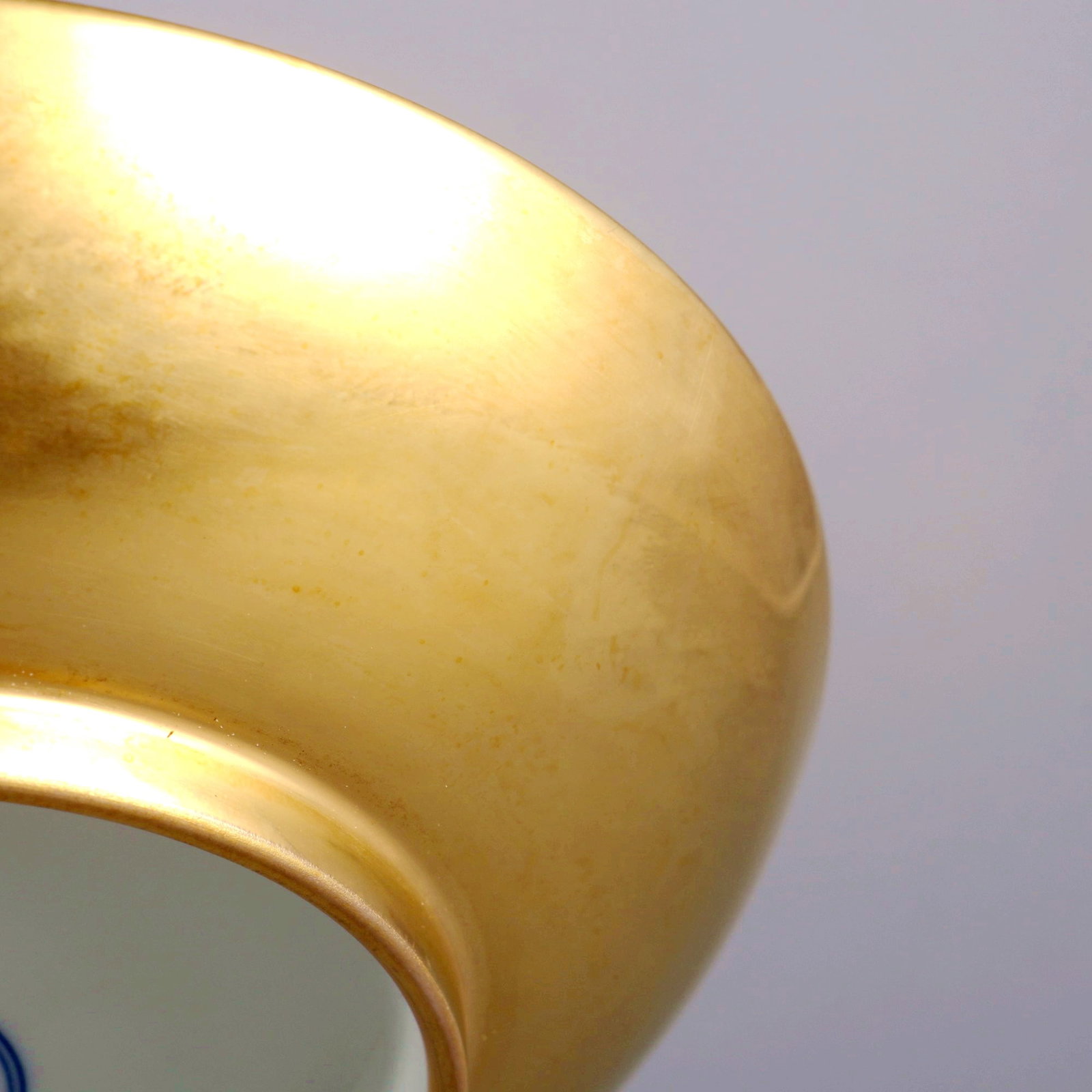 A GOLD GLAZED APPRECIATION DISH - 9