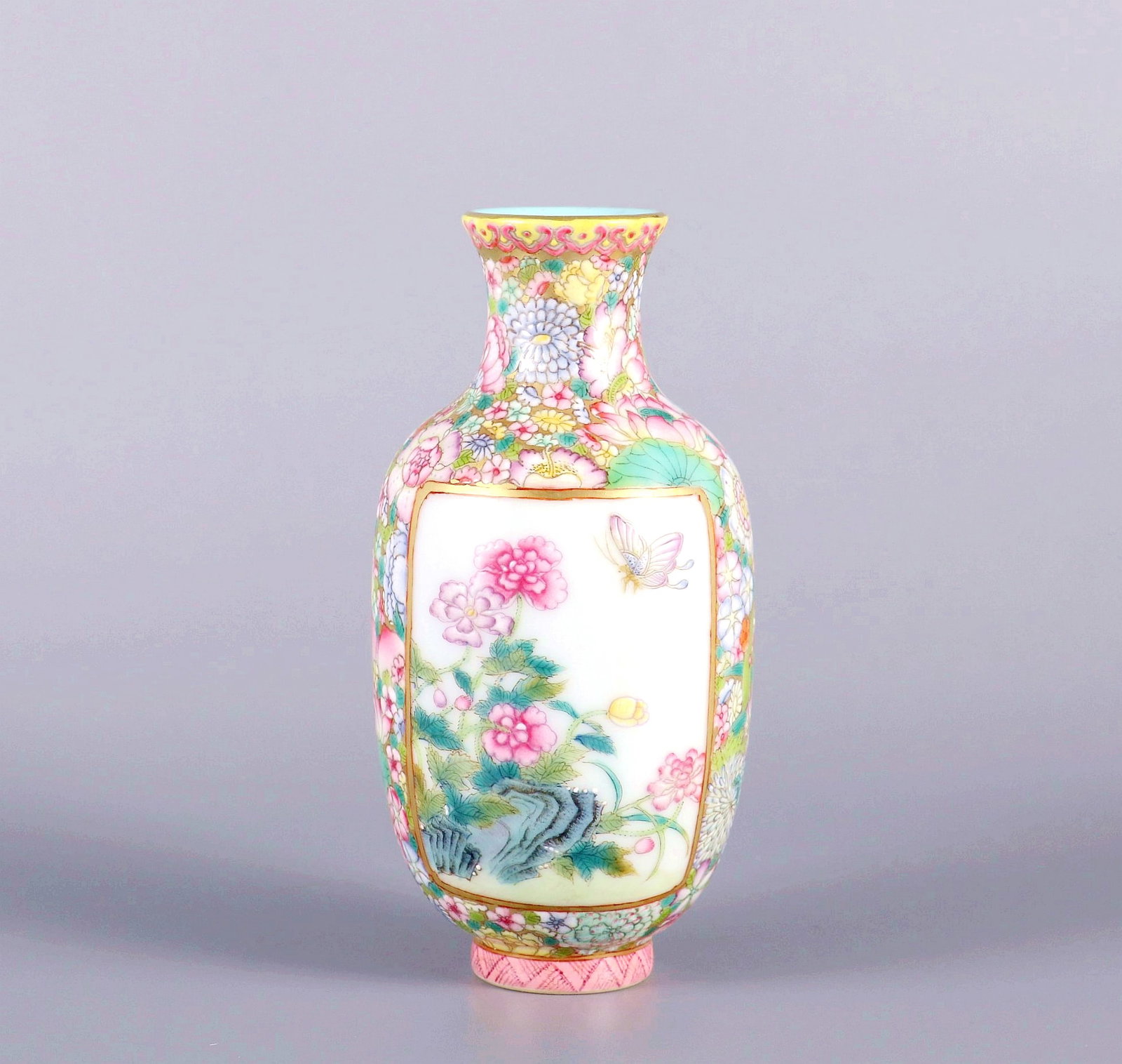 A GOLD GROUND FAMILLE ROSE MYRIAD FLOWERS WITH OPEN WINDOW BUTTERFLY AND FLOWER VASE (1 of 8)