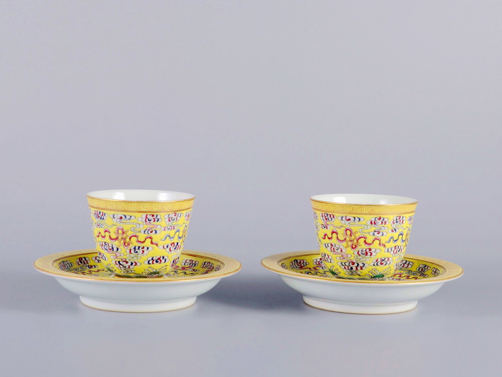 A PAIR OF YELLOW GROUND FAMILLE ROSE ETERNAL LONGEVITY COVERED CUPS (1 of 9)